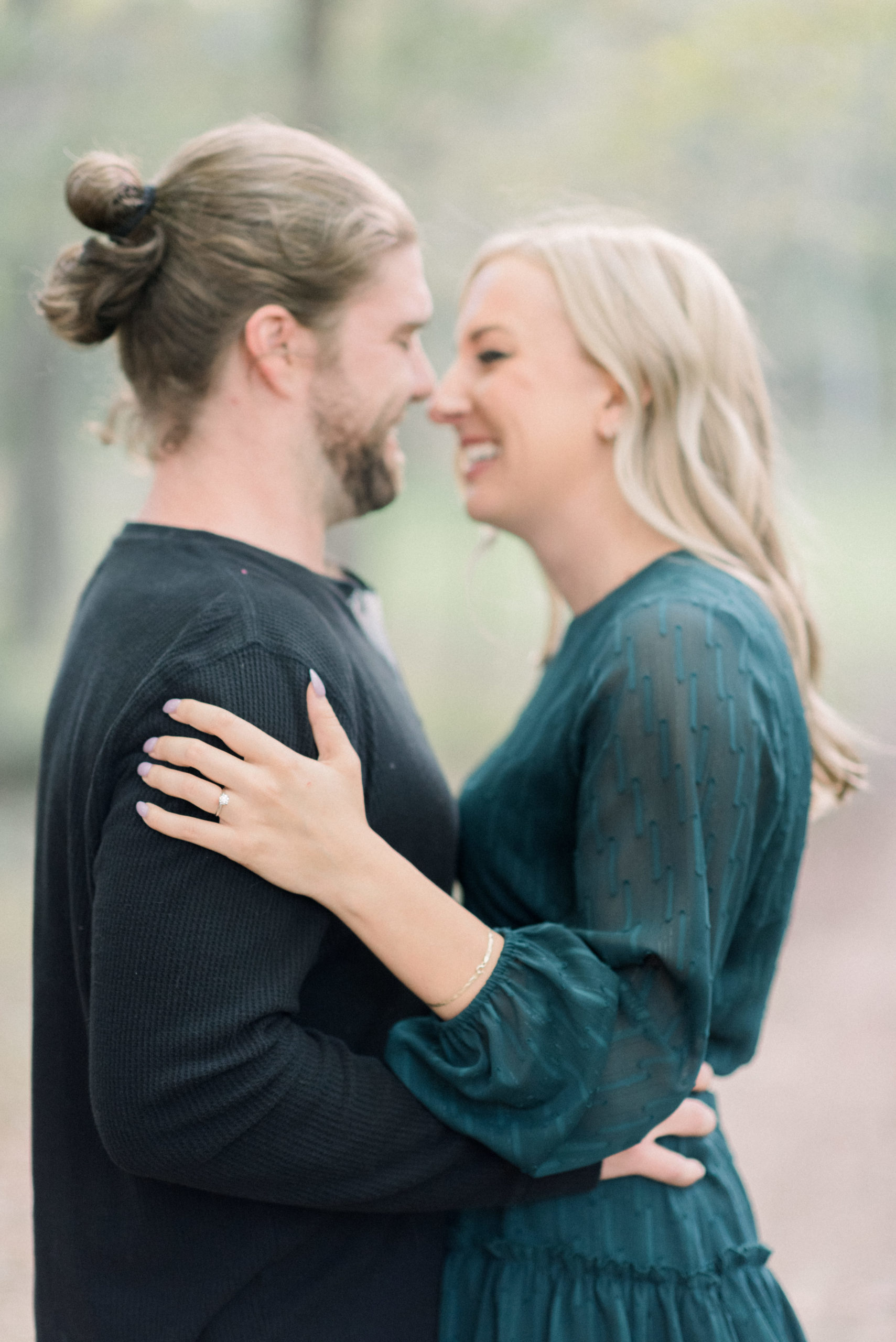 newly engaged couple laughing together during portraits
