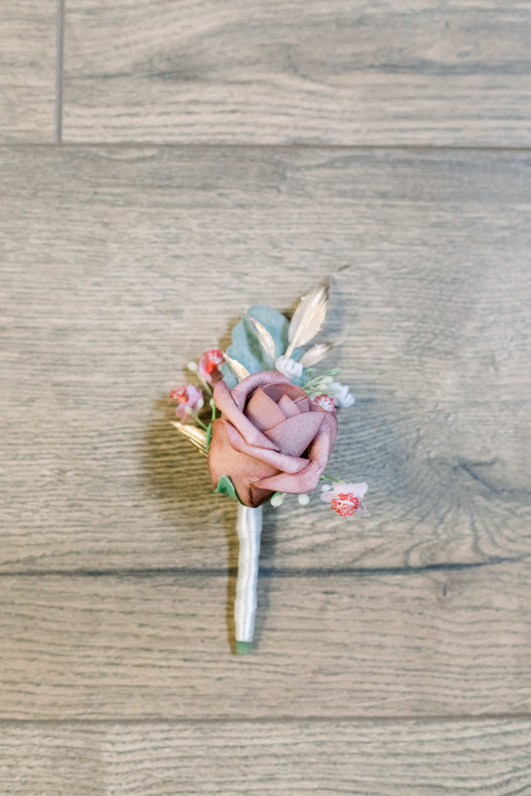 pink rose styled boutonnière
