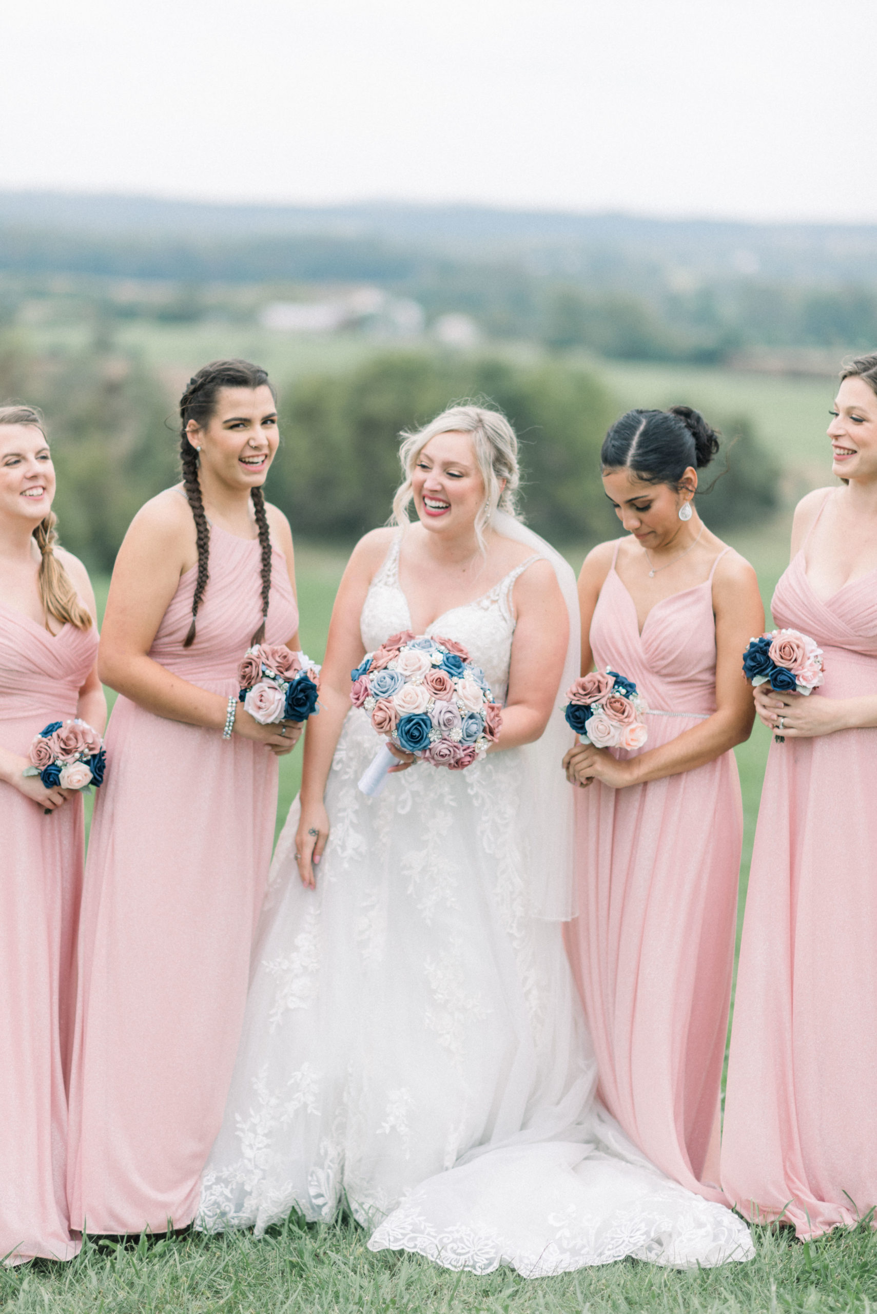 bride laughing during bridal portraits with bridesmaids