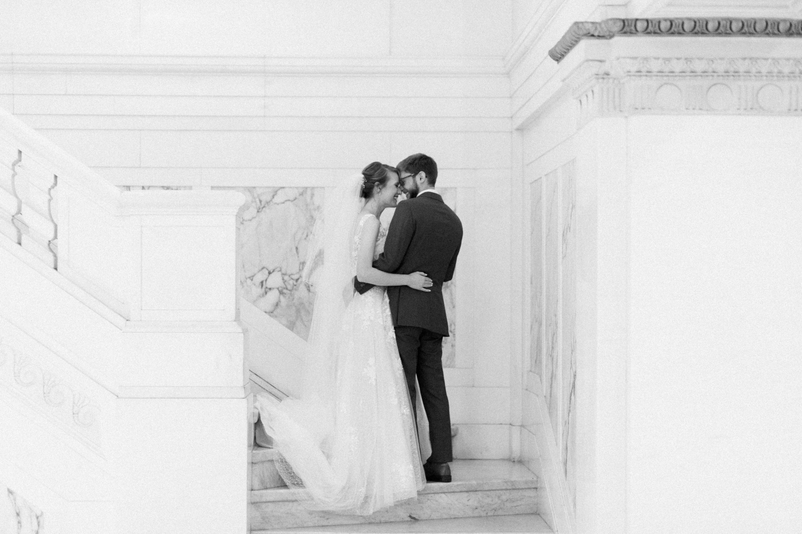bride and groom embracing during first look before elegantly Modern Accelerator Baltimore Wedding