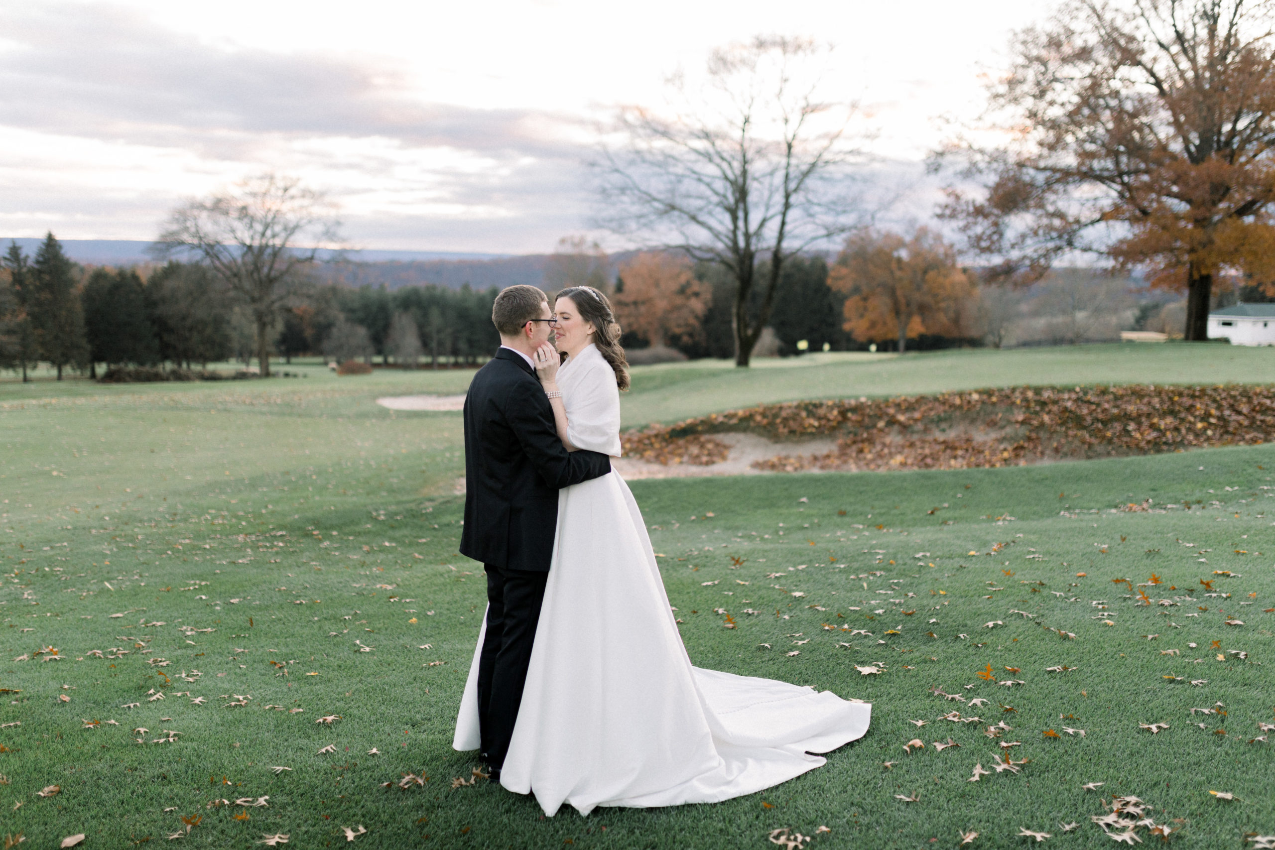 bride and groom hugging during outdoor portraits