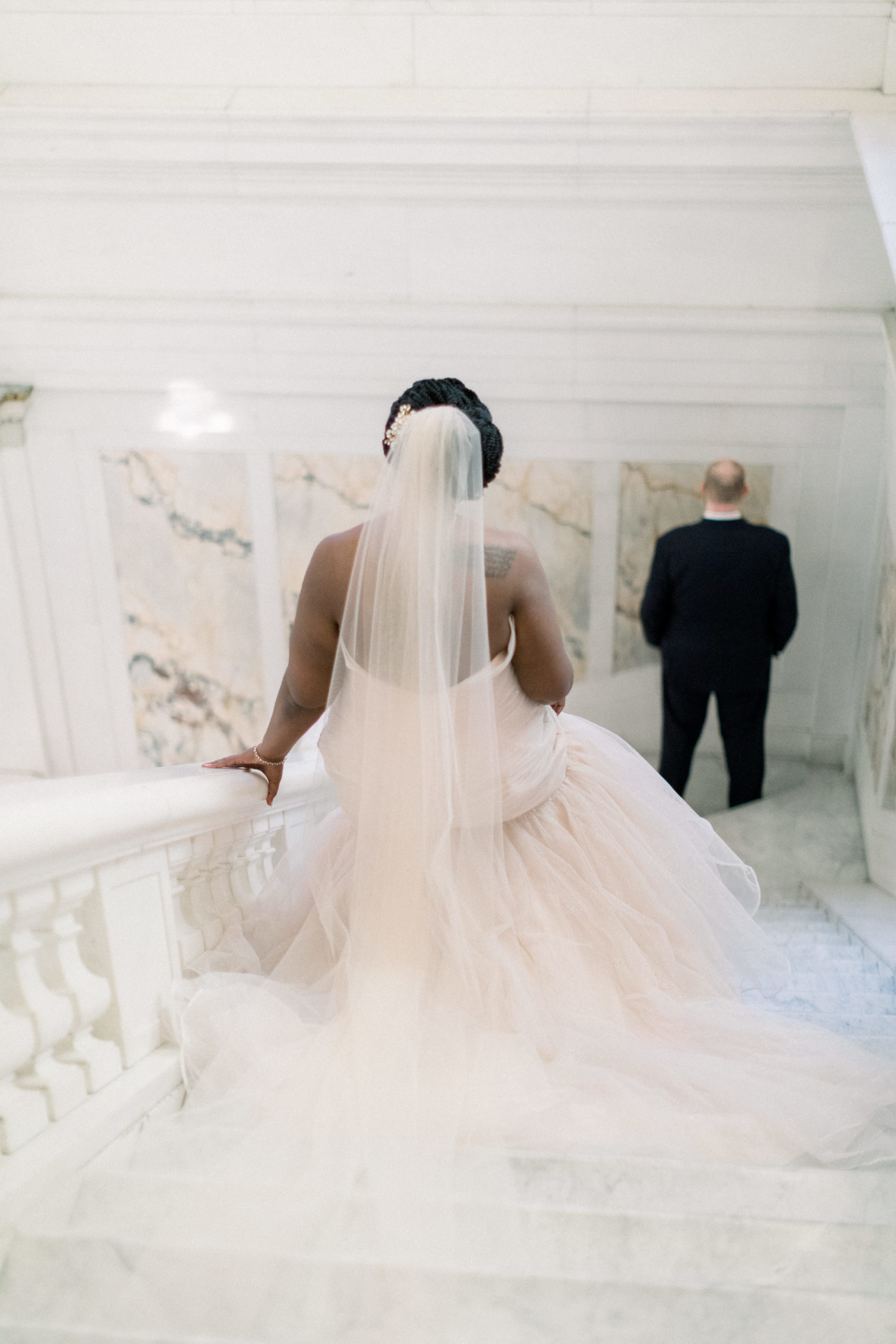 bride and groom walking down stairs before Romantic Fall Baltimore Wedding