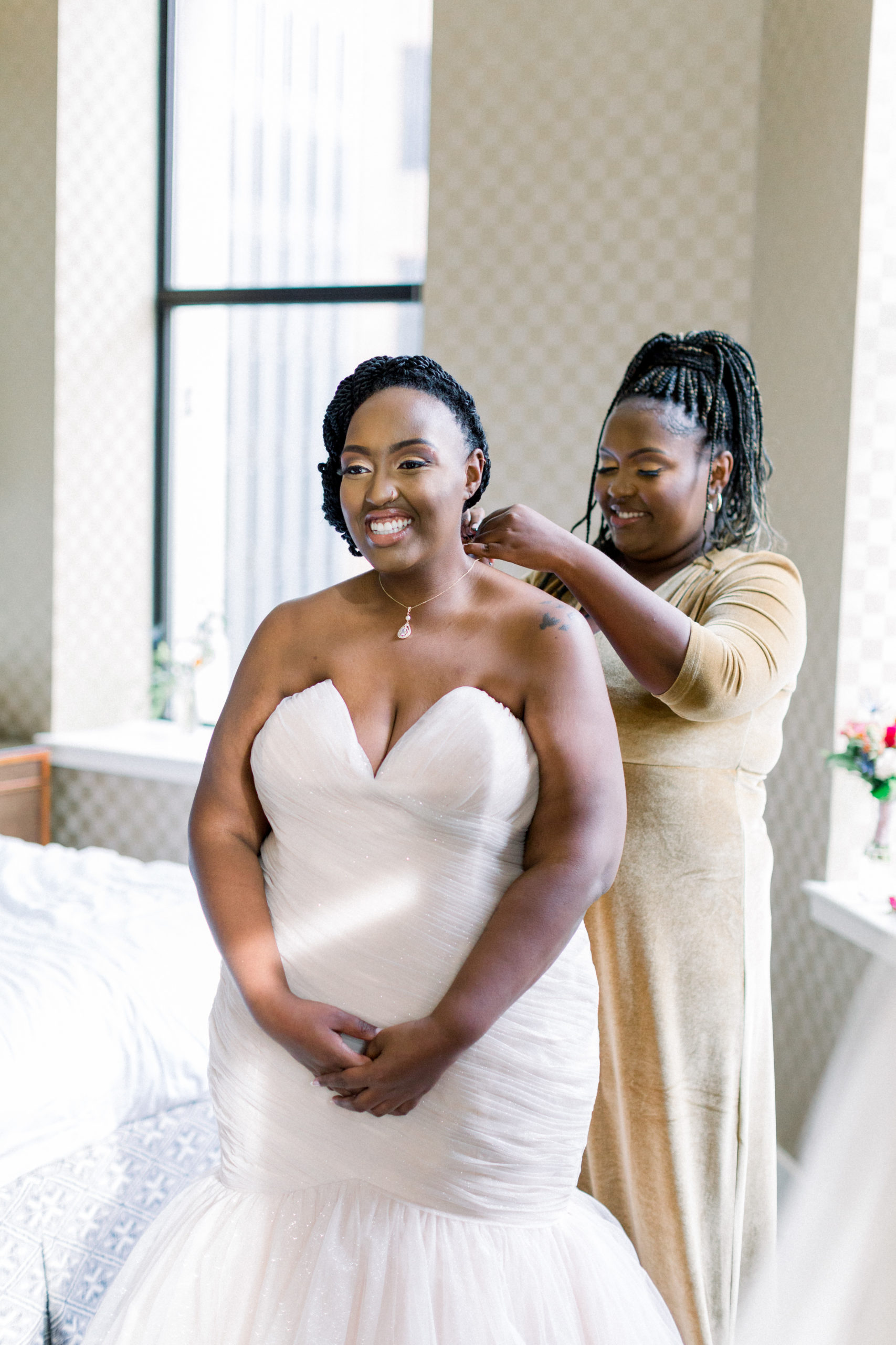 bride getting jewelry put on before Romantic Fall Baltimore Wedding