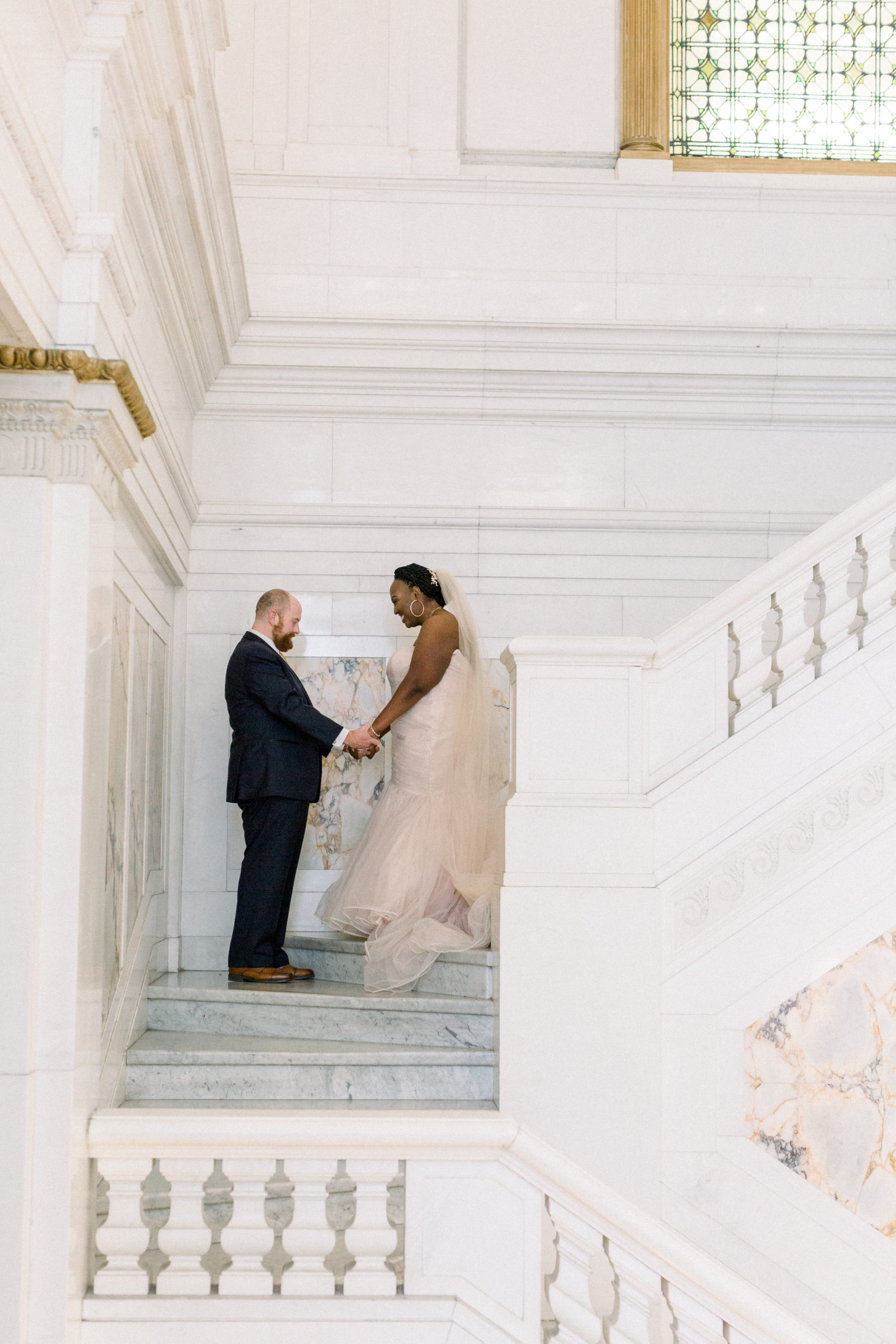 bride and groom holding hands during first look before Romantic Fall Baltimore Wedding