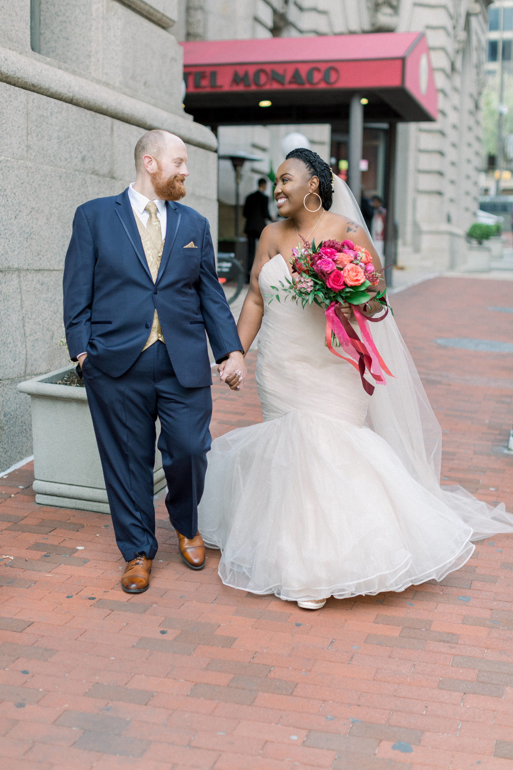 bride and groom walking hand in hand after Romantic Fall Baltimore Wedding