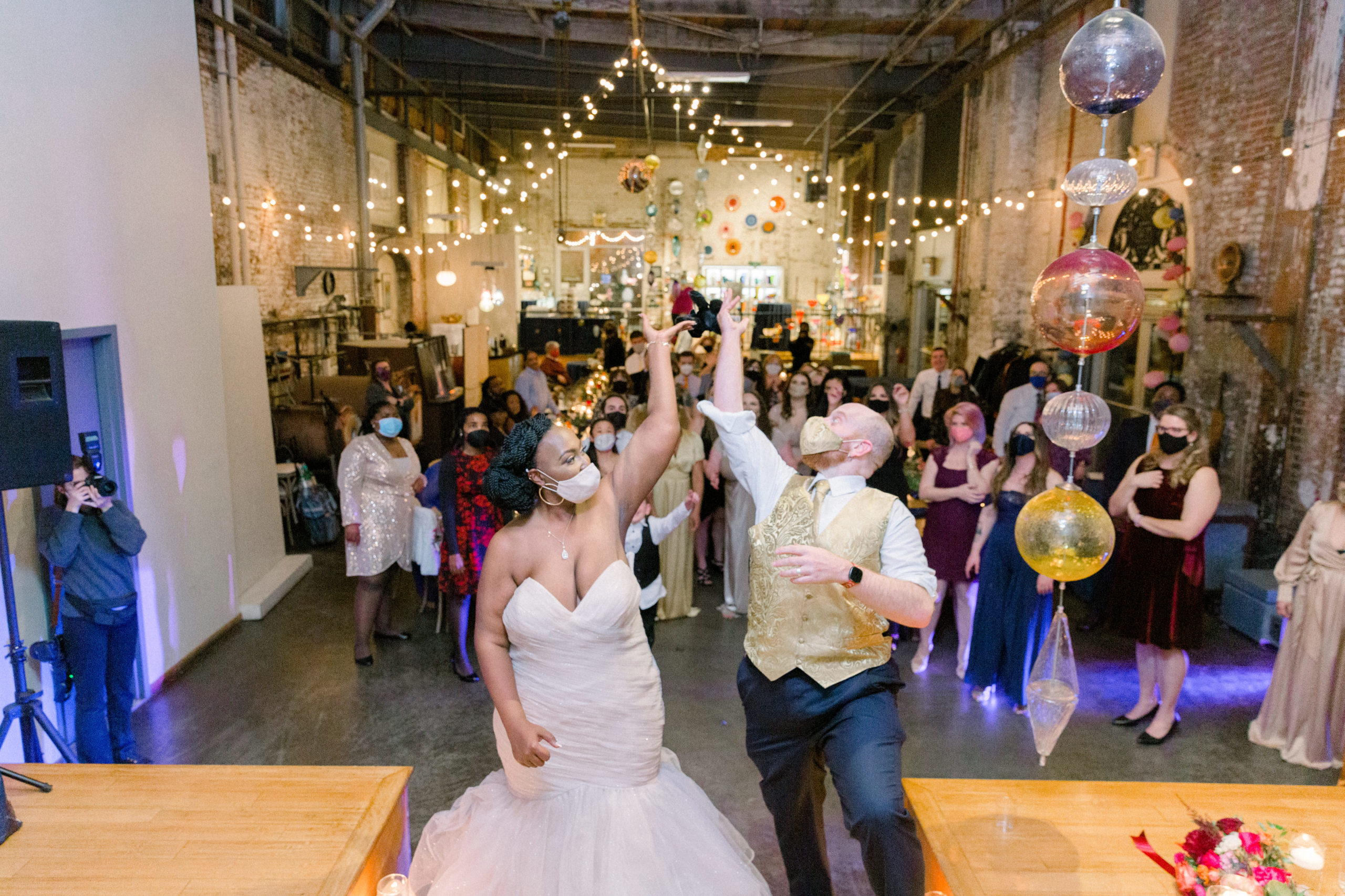 bride and groom throwing bouquet at Romantic Fall Baltimore Wedding reception
