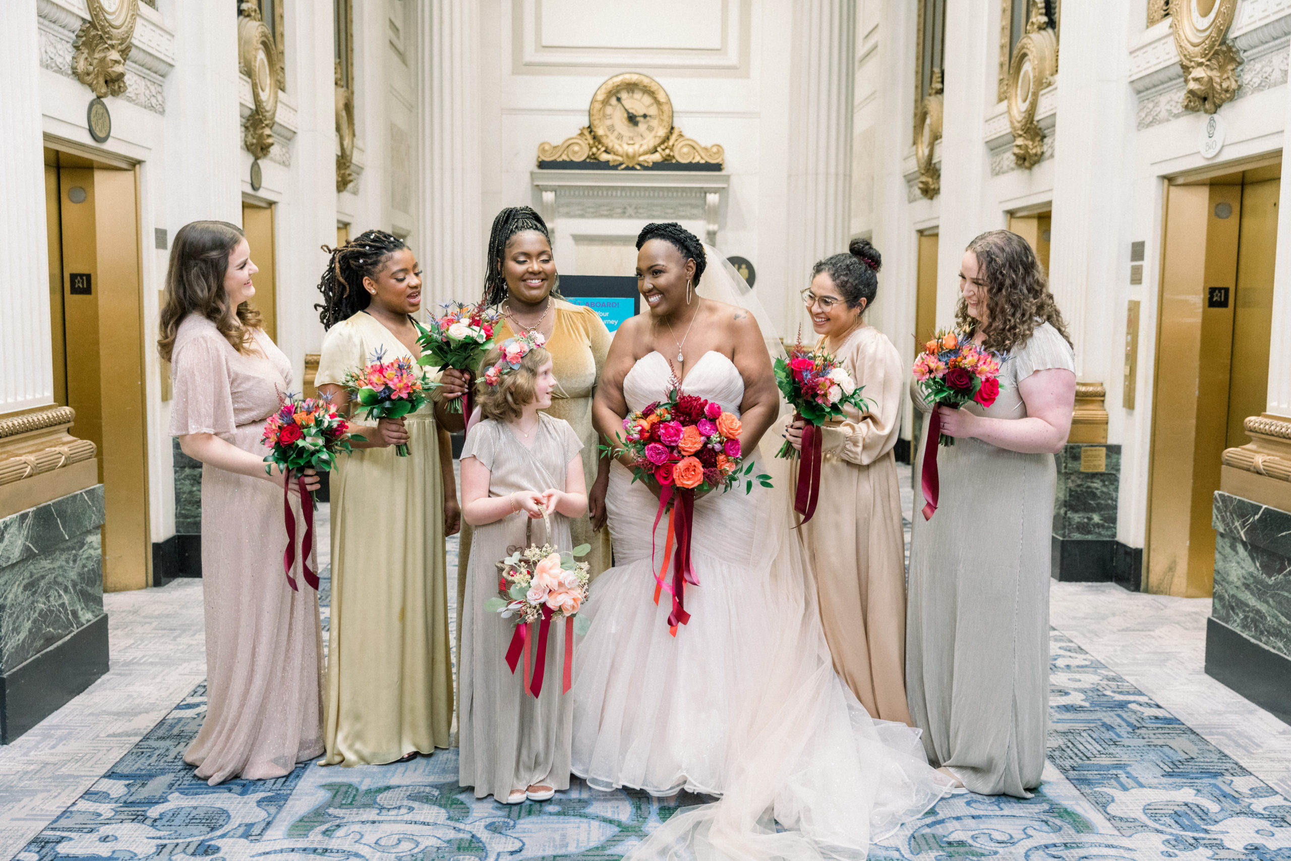 bride laughing with bridesmaids after Romantic Fall Baltimore Wedding