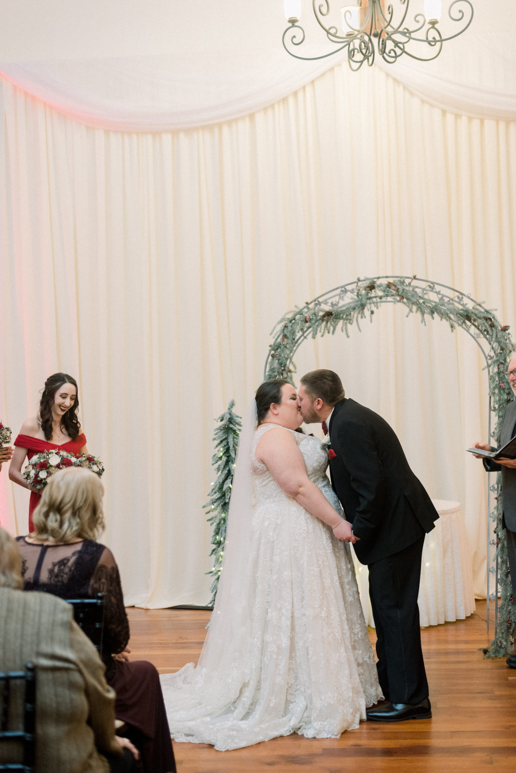 bride and groom kiss as husband and wife