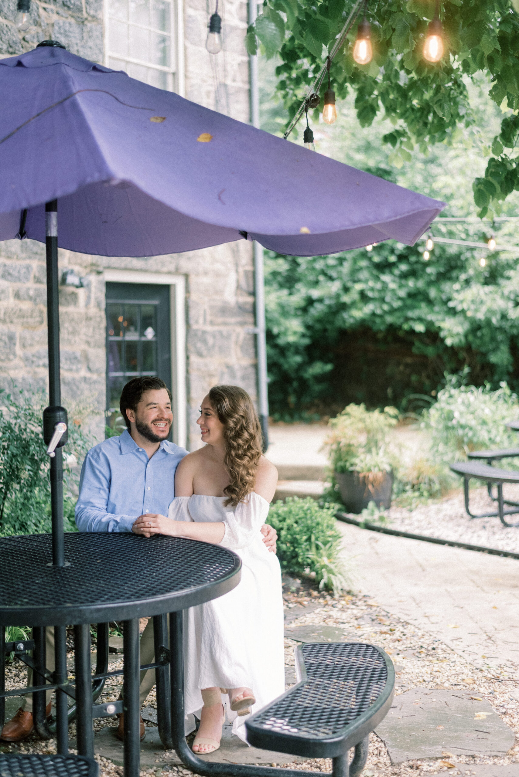 Maryland wedding photographer captures couple sitting together at table
