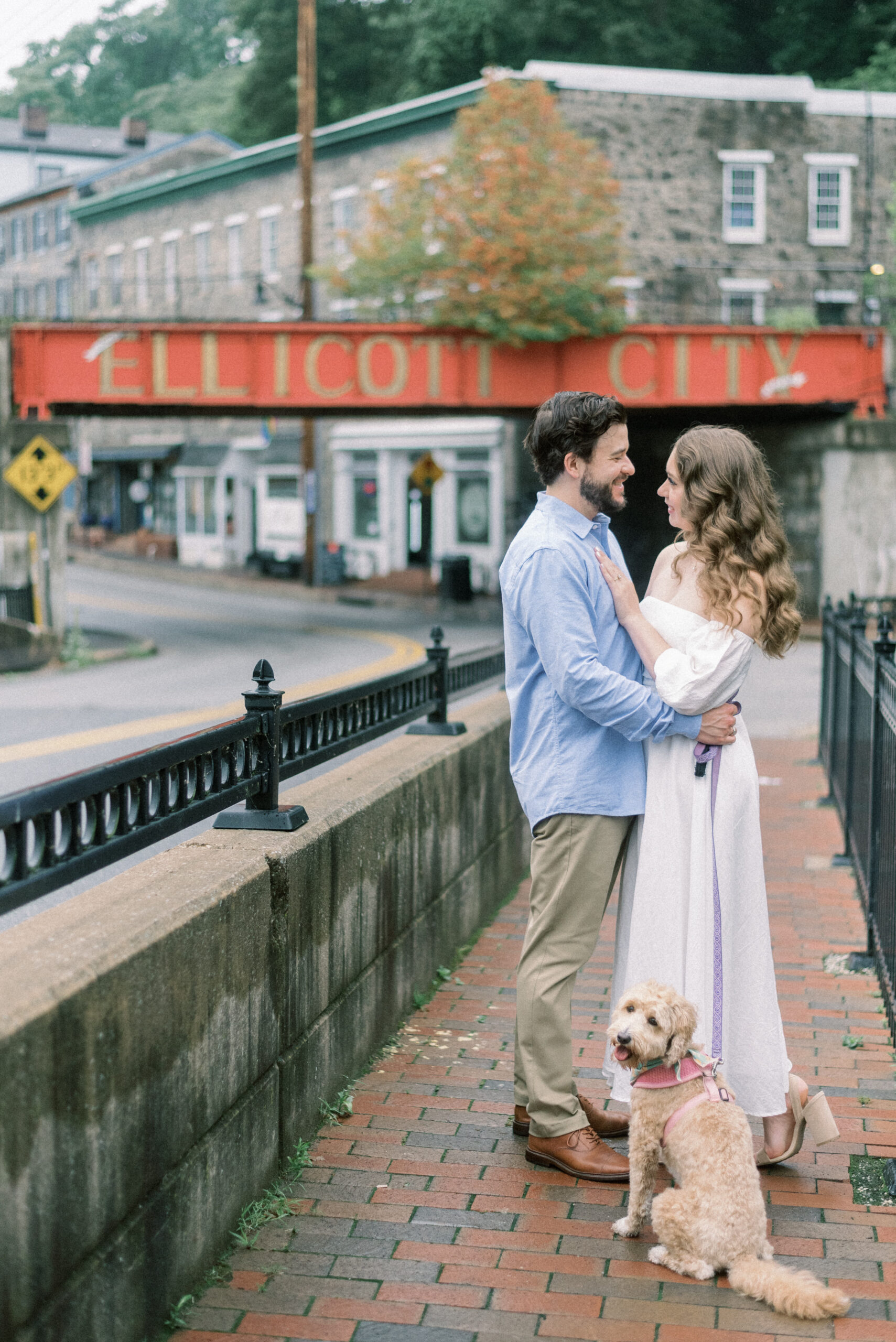 Maryland wedding photographer captures man and woman hugging during Old Ellicott City Engagement Photos