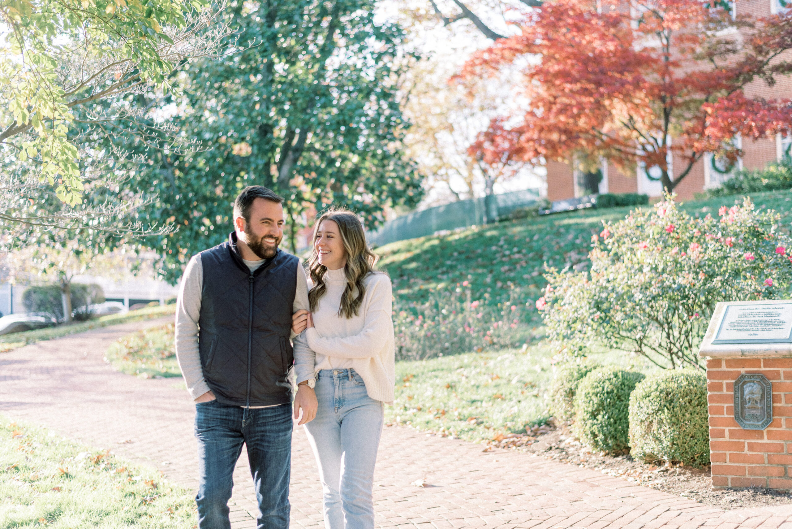 Maryland wedding photographer captures couple walking together in downtown Annapolis fall weather
