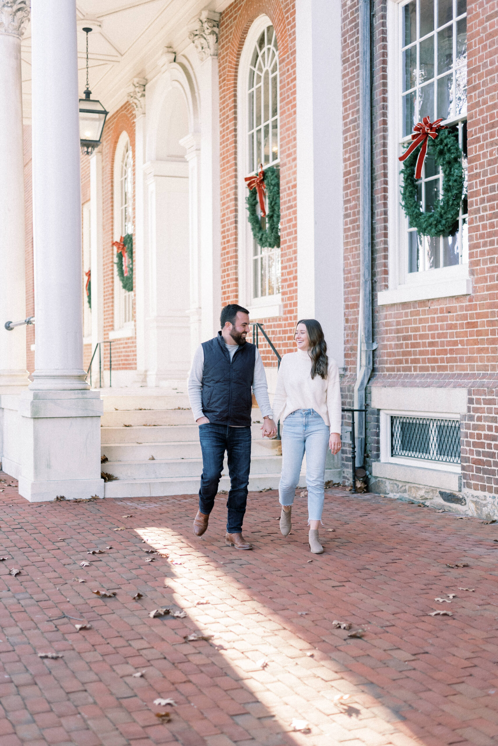 Maryland wedding photographer captures woman leading man in downtown Annapolis