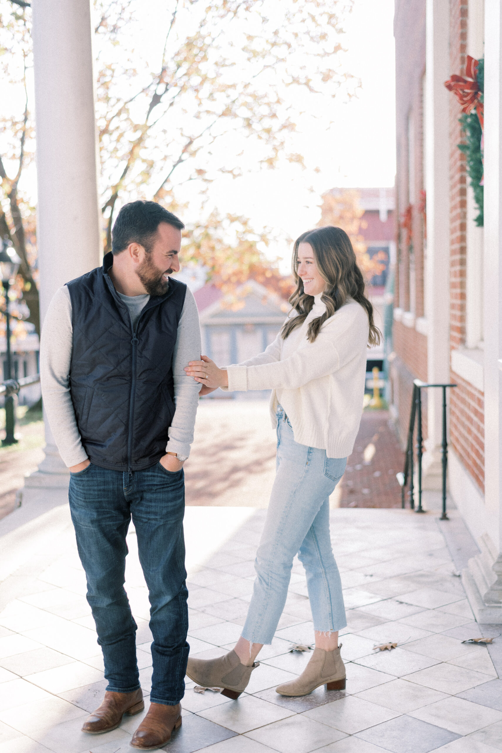 Maryland wedding photographer captures couple joking together during outdoor engagement portraits