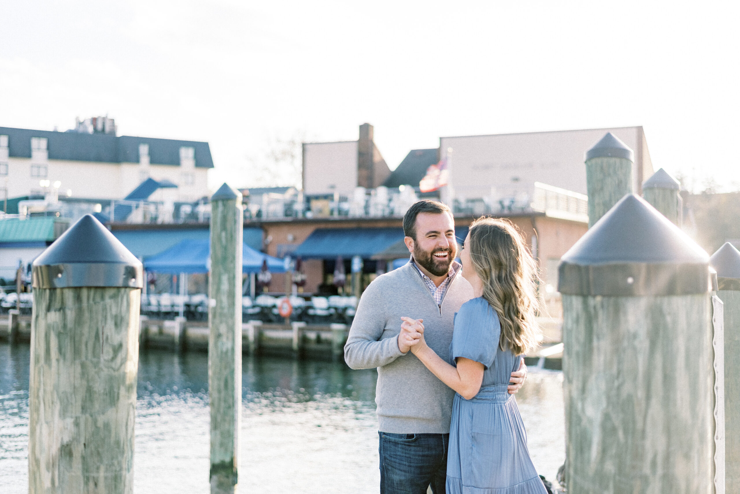 Maryland wedding photographer captures couple holding hands on dock