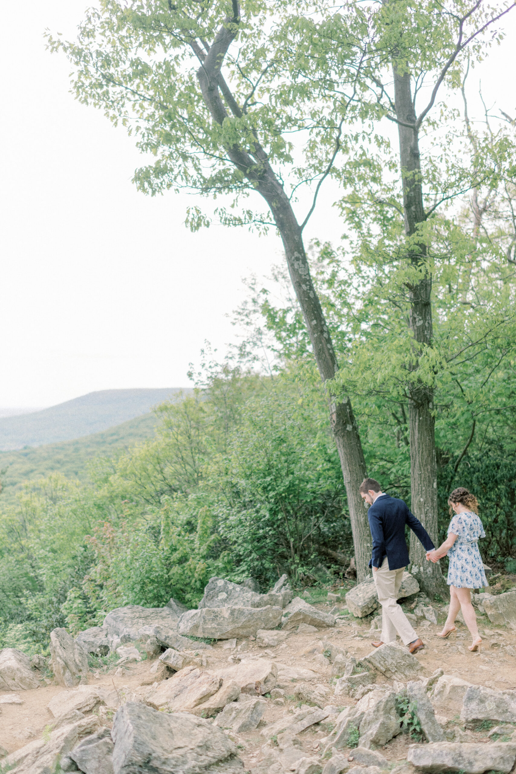 Maryland wedding photographer captures couple holding hands and walking together