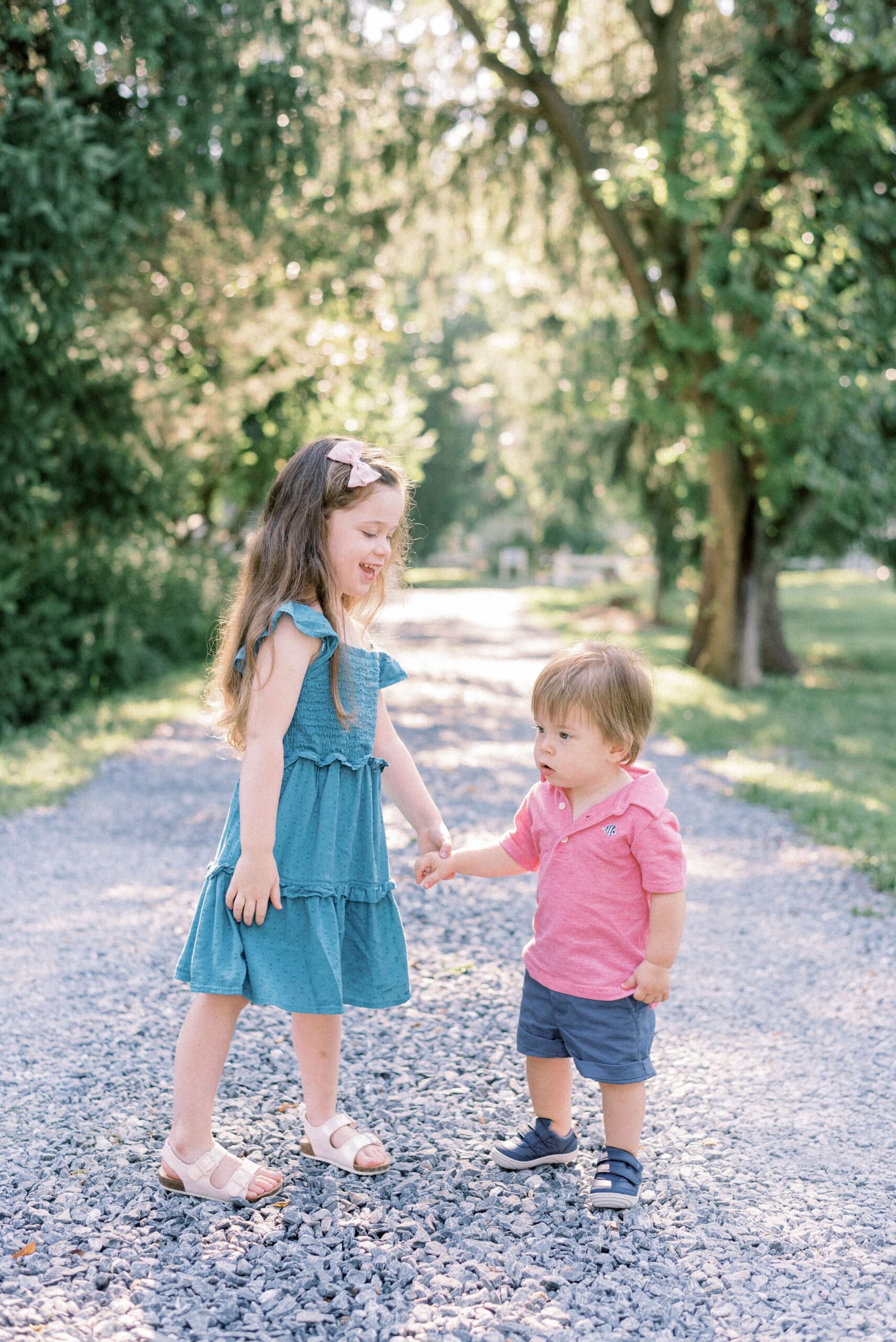 Maryland photographer captures brother and sister holding hands and walking together