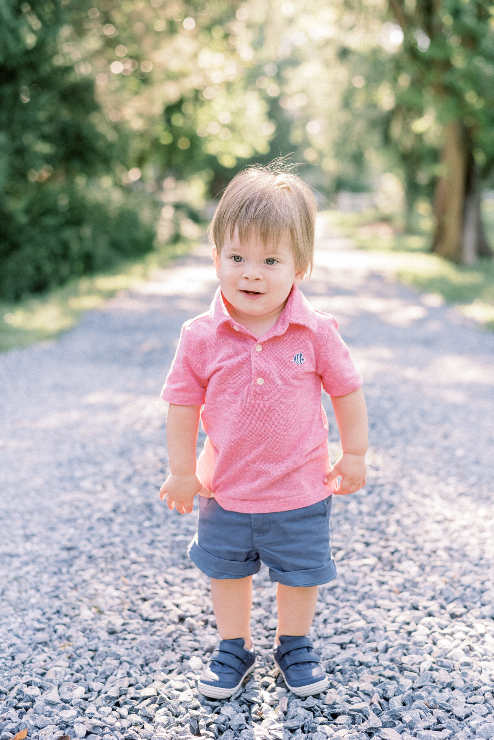 Maryland photographer captures young boy wearing pink shirt during outdoor fall Howard County extended family portraits