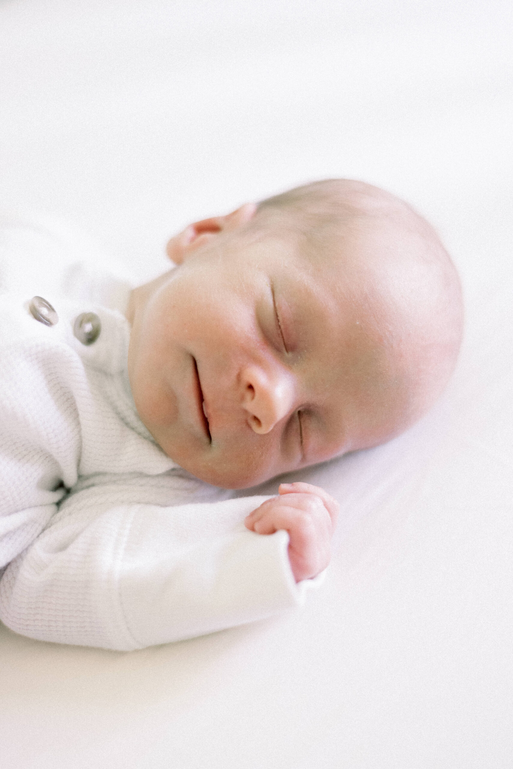 Pennsylvania photographer captures baby sleeping with a smile on his face during Hanover Pennsylvania newborn portraits
