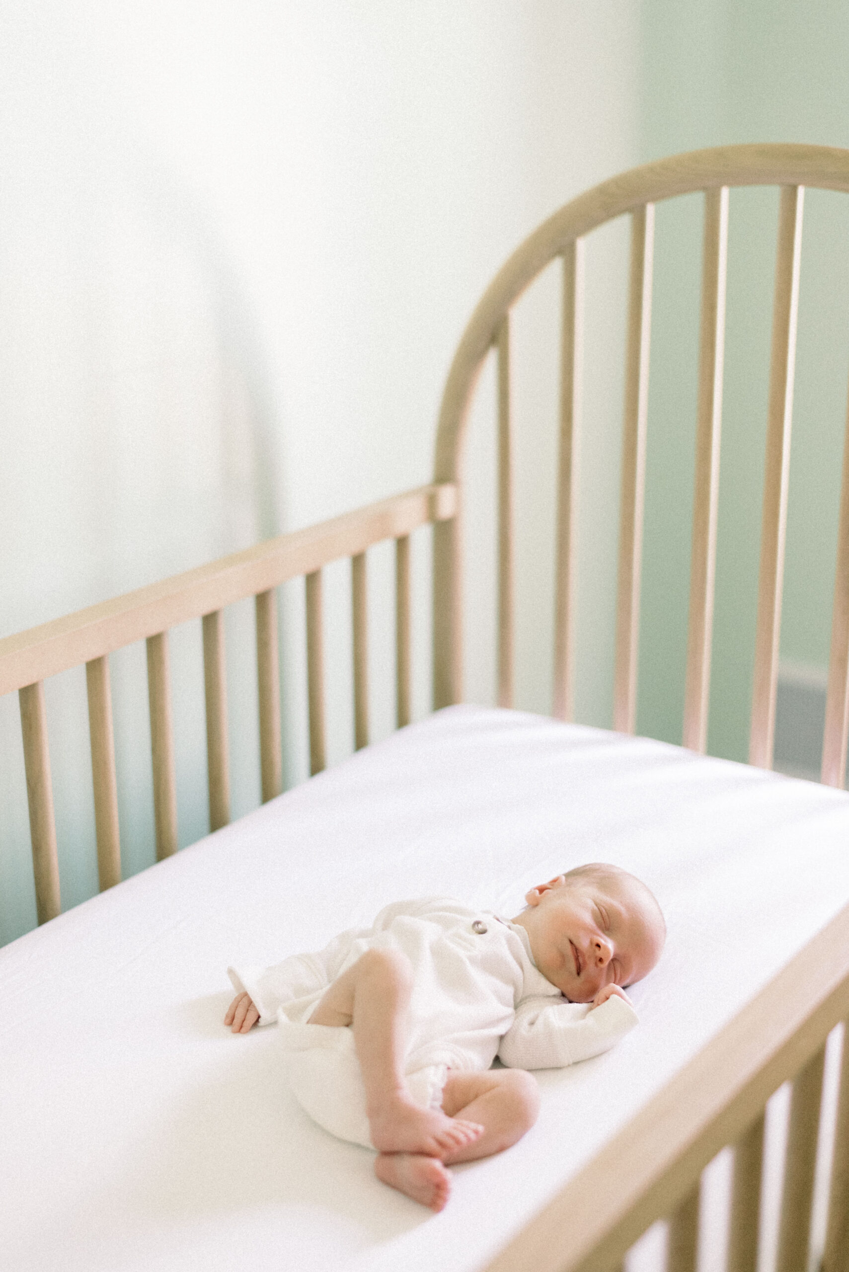Pennsylvania photographer captures newborn baby laying in crib during Hanover Pennsylvania newborn portraits