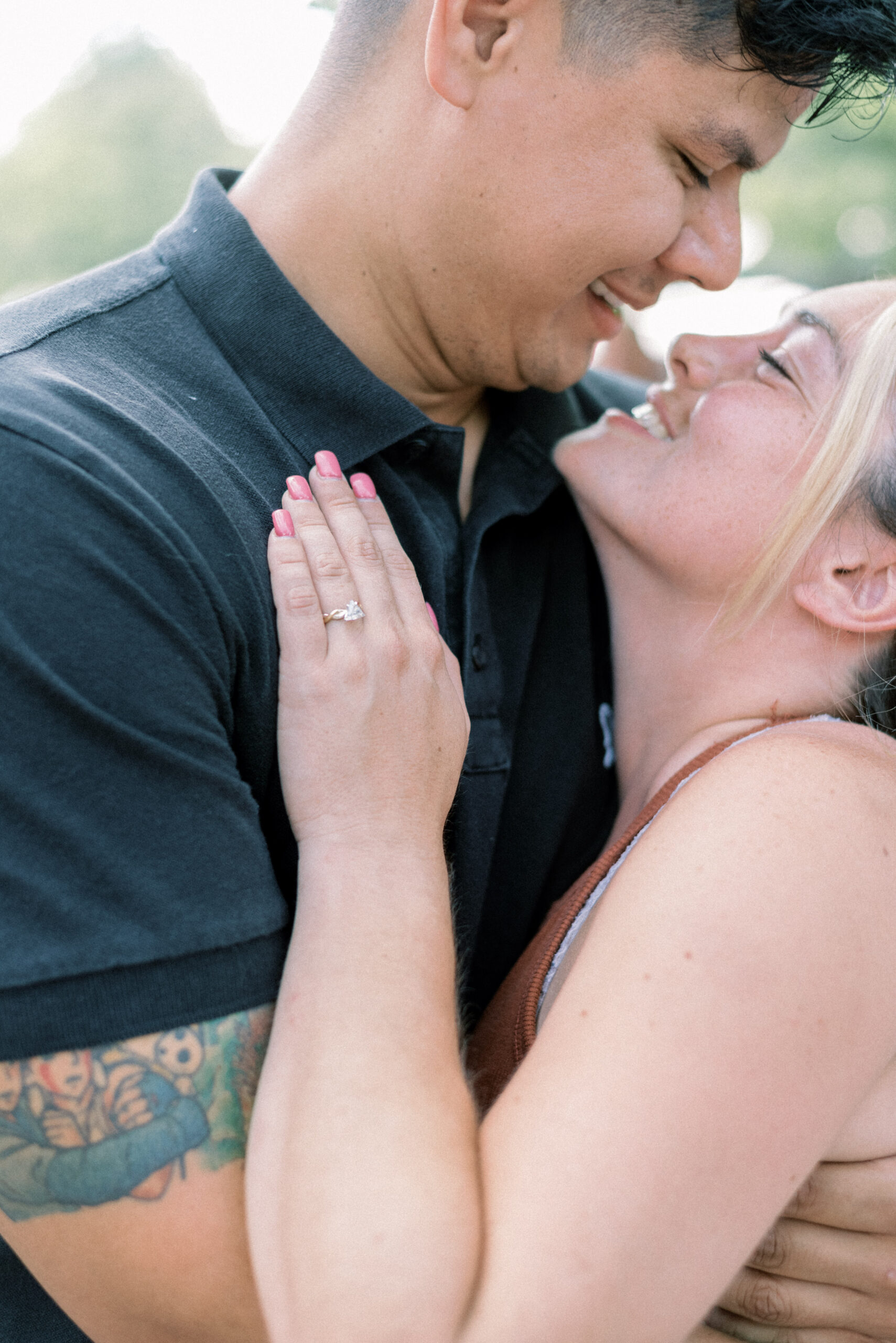Maryland photographer captures couple hugging and smiling at one another