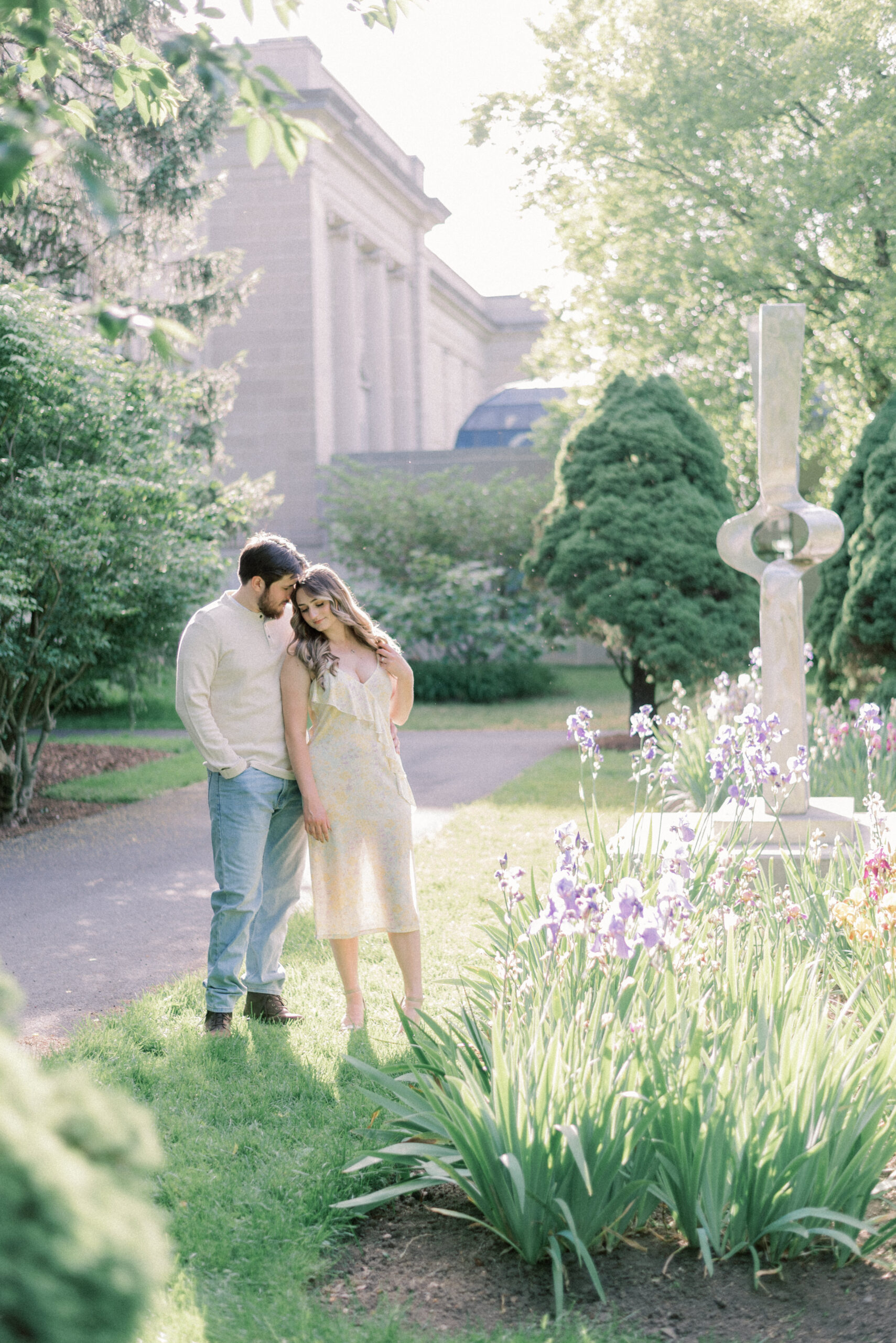 Maryland wedding photographer captures couple hugging in garden outside Reading Museum