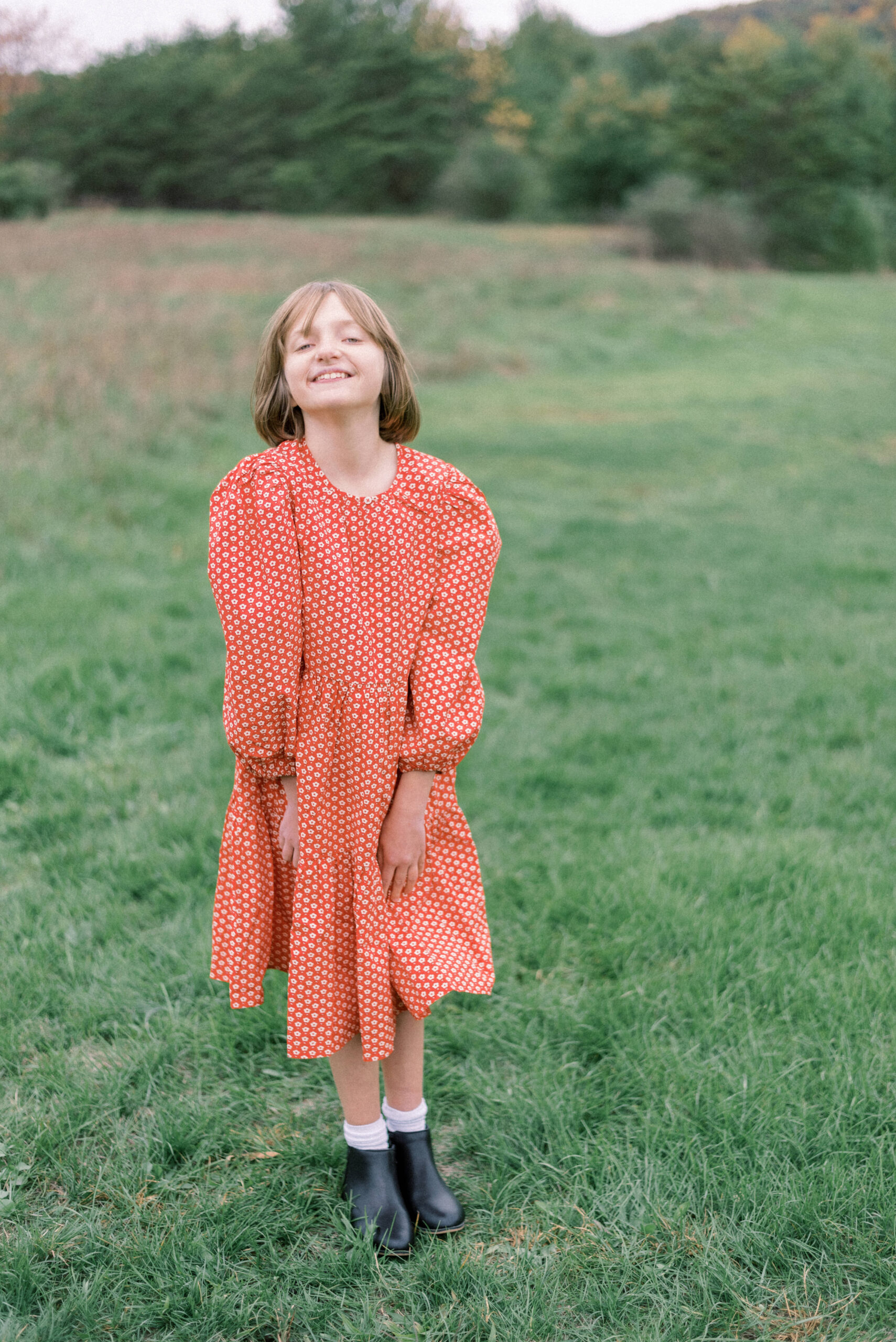Pennsylvania photographer captures young girl smiling at camera during fall family photos at orwigsburg pa