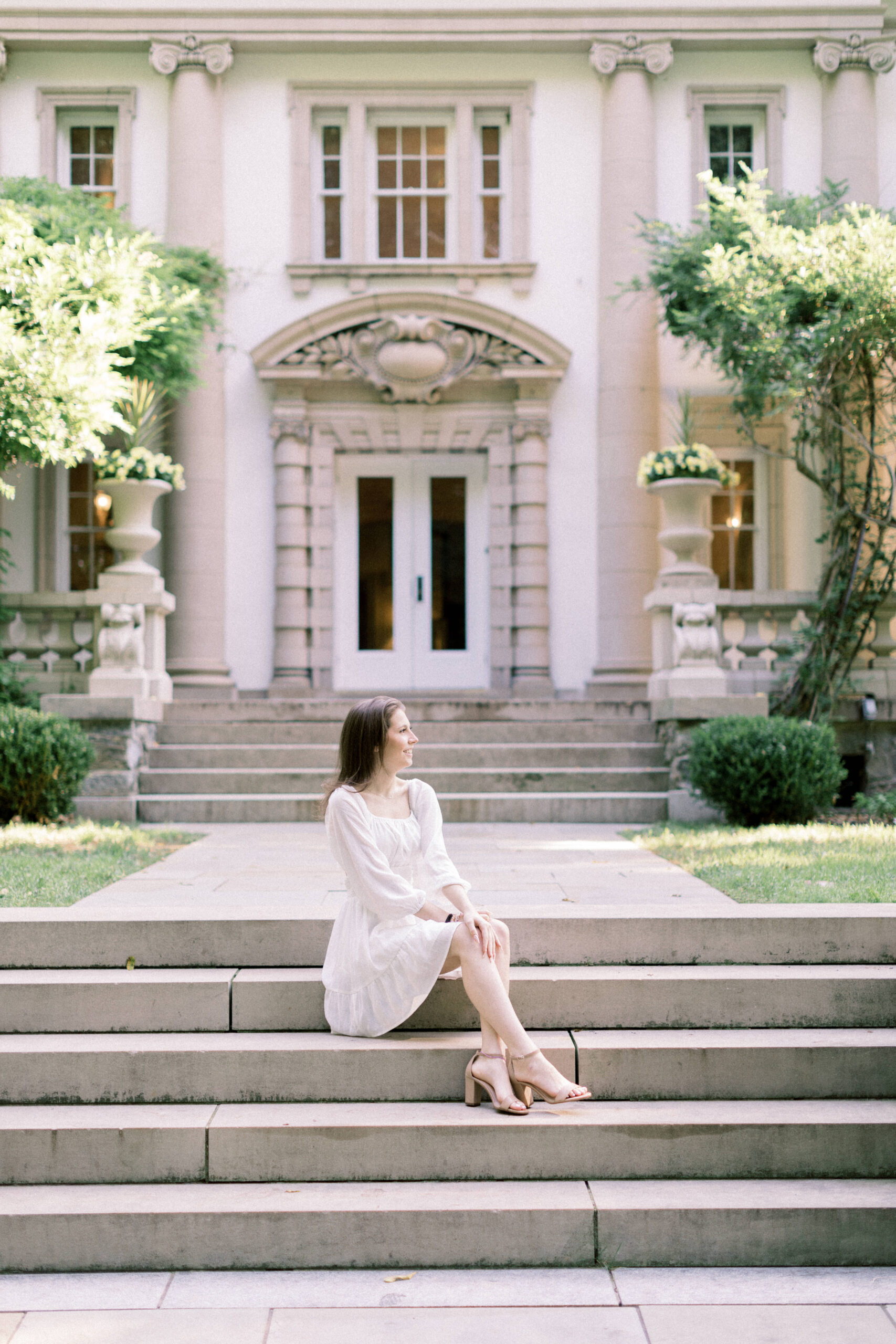 Maryland photographer captures senior wearing white dress on steps of Liriodendron Mansion