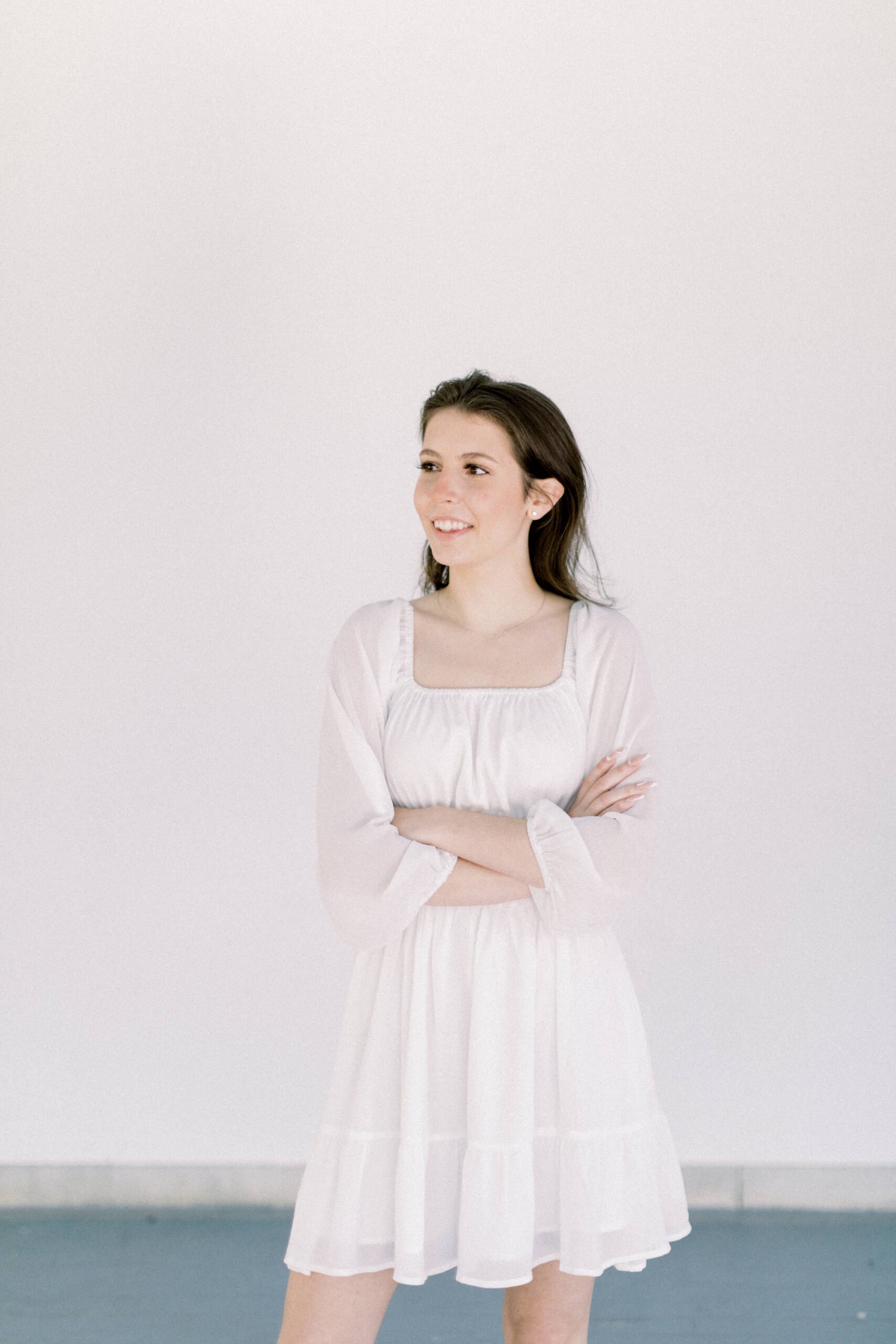 Maryland photographer captures young woman wearing white dress during photos