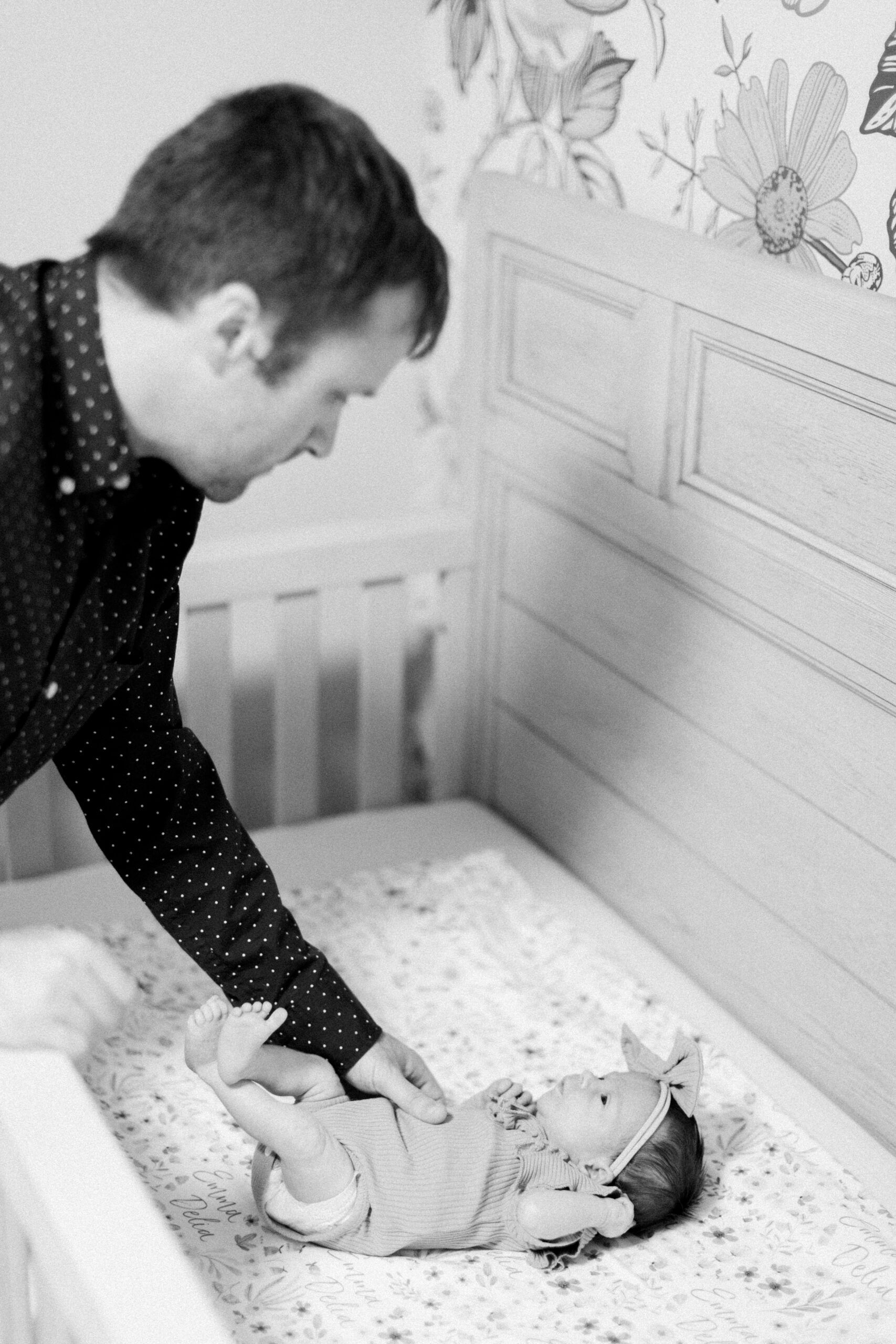 Maryland photographer captures father putting baby into crib