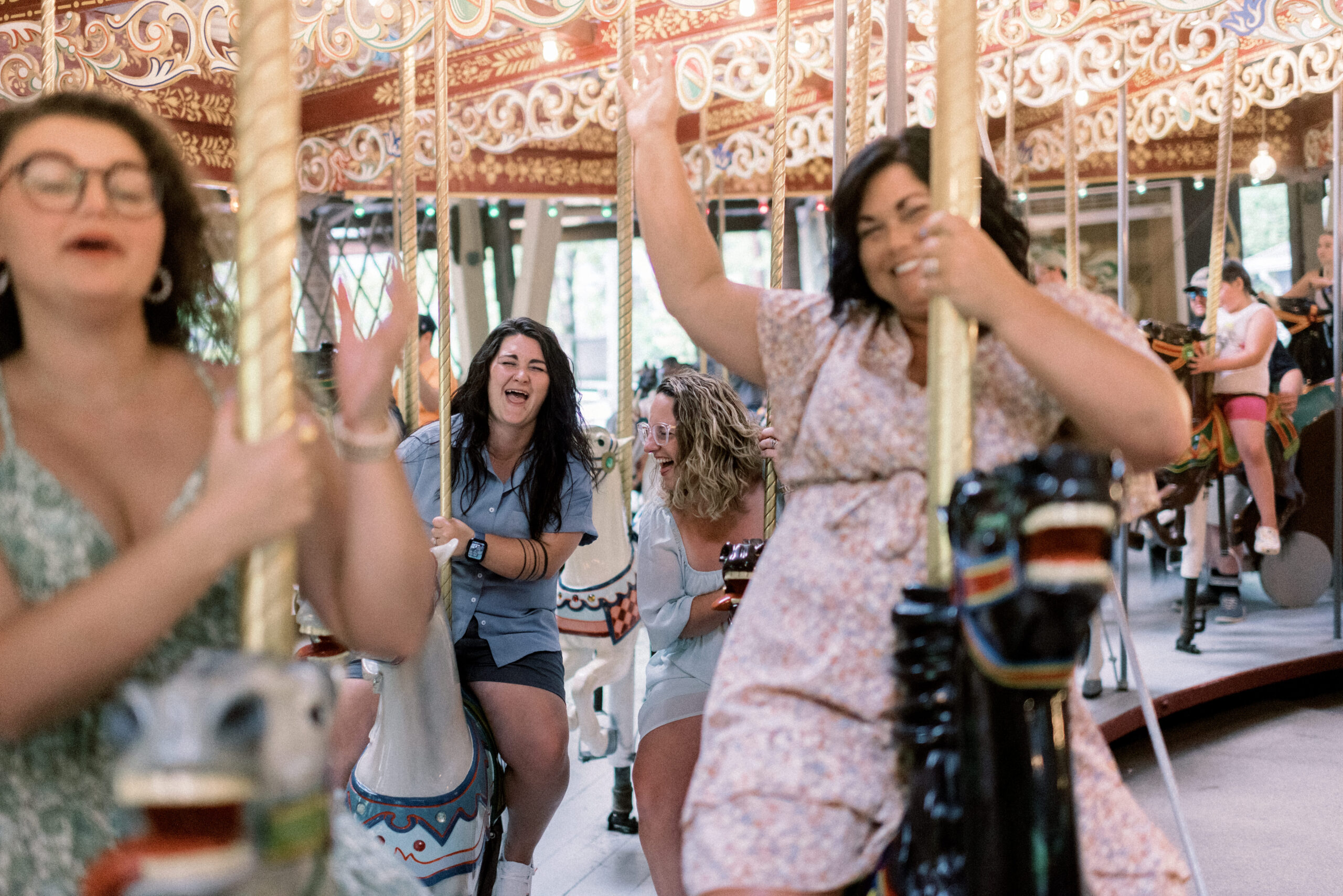Maryland wedding photographer captures family on carousel during Knoebels family portraits