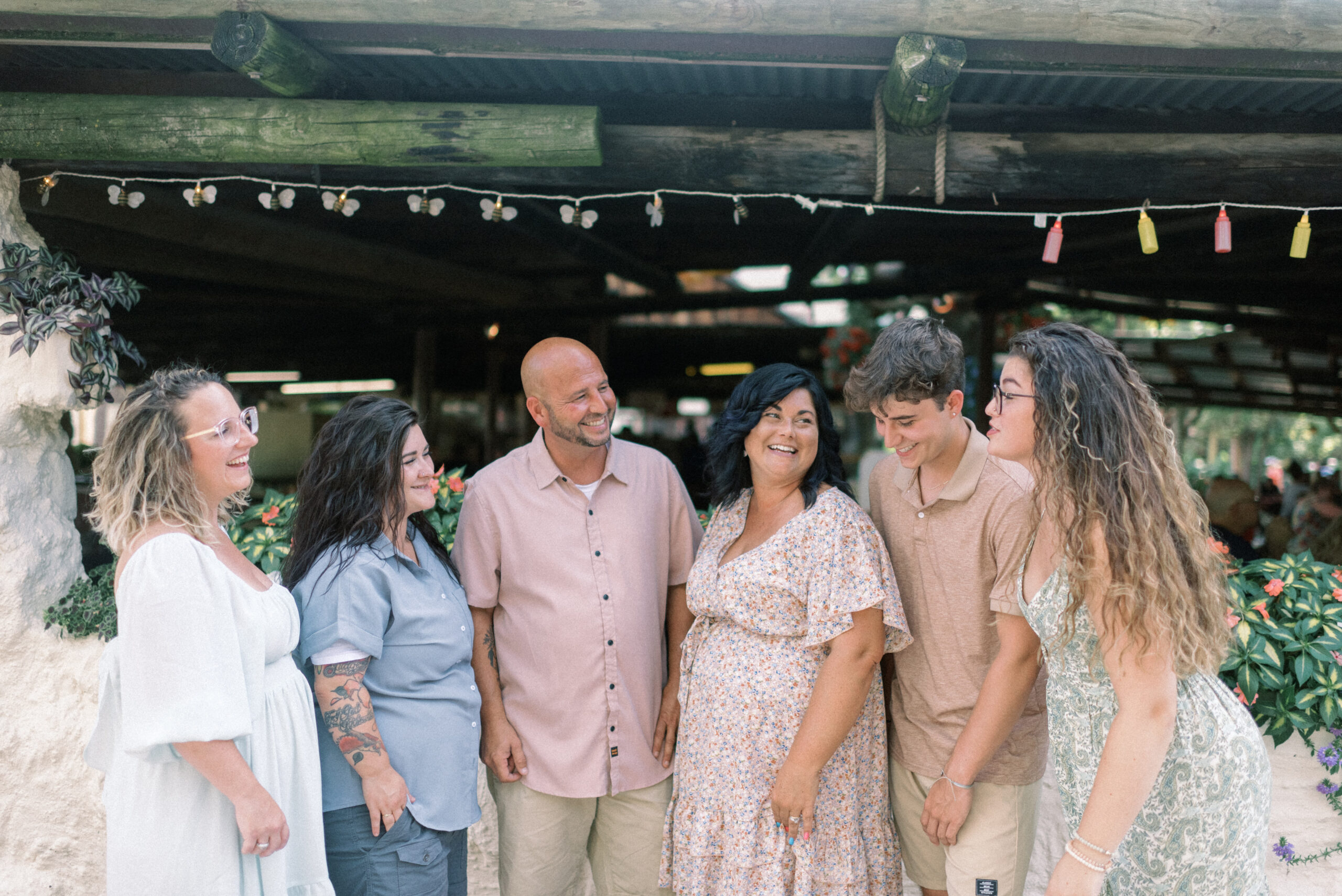 Maryland wedding photographer captures family laughing together during knoebels family portraits