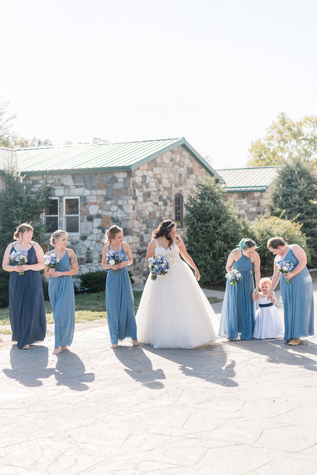 Pennsylvania wedding photographer captures bride walking with flower girl and bridesmaids