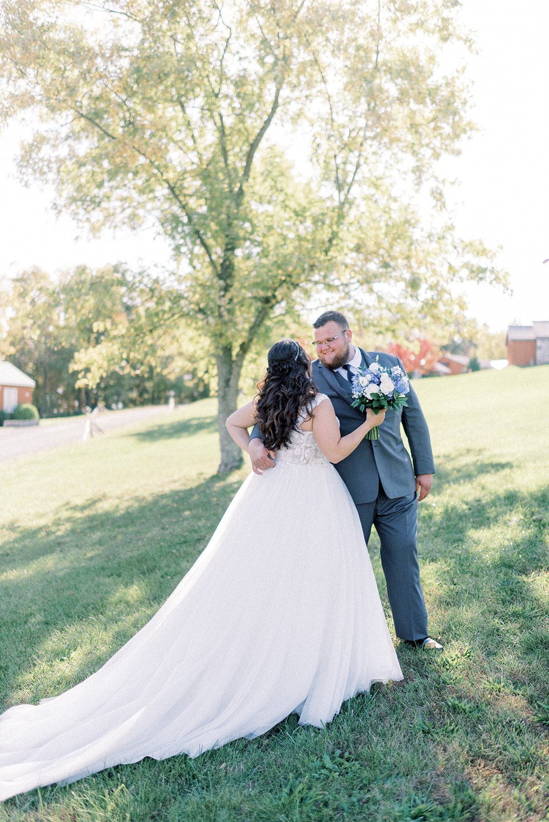 Pennsylvania wedding photographer captures groom hugging bride after first look