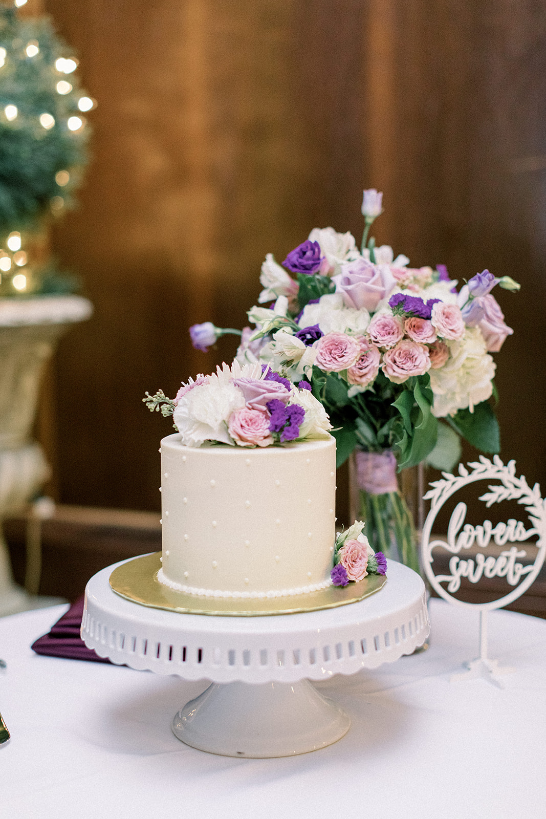 Pennsylvania wedding photographer captures wedding cake with purple flowers