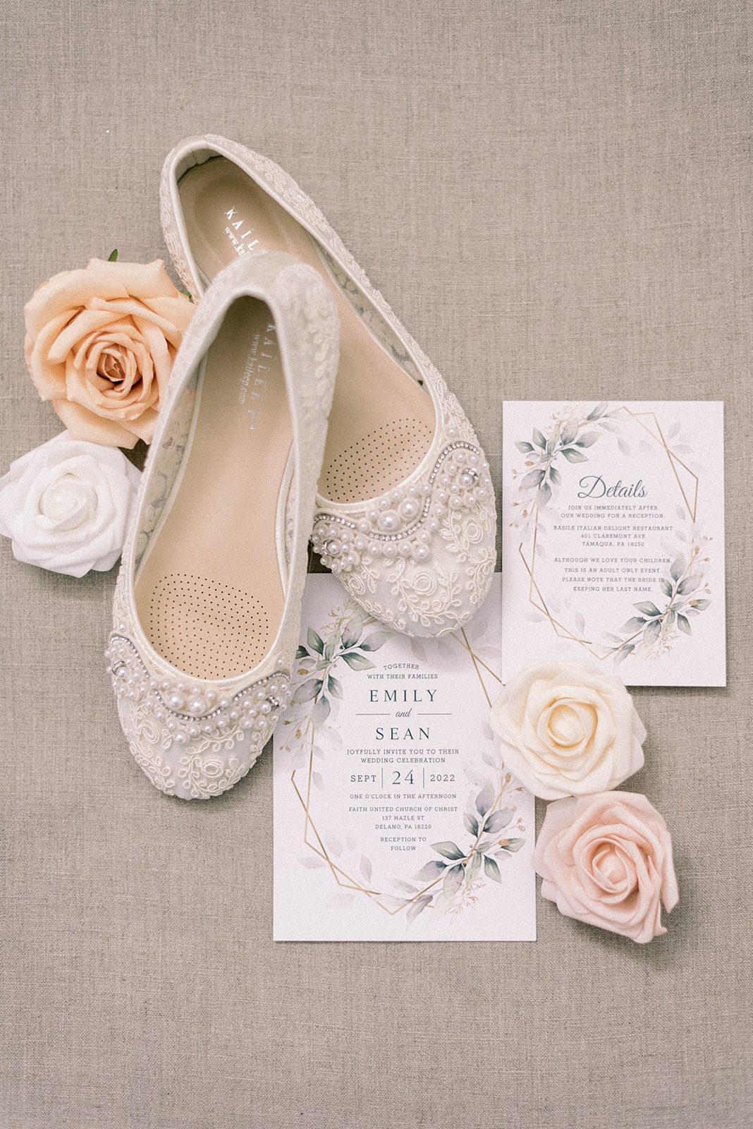 Pennsylvania wedding photographer captures bridal shoes with flowers and invitations next to them