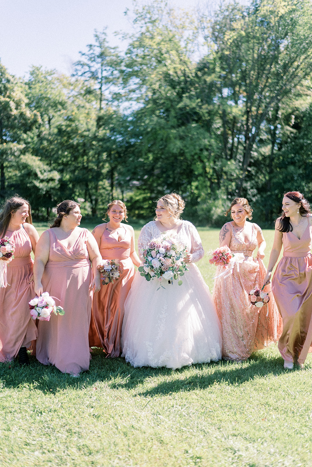 Pennsylvania wedding photographer captures bride with bridesmaids wearing pink dresses