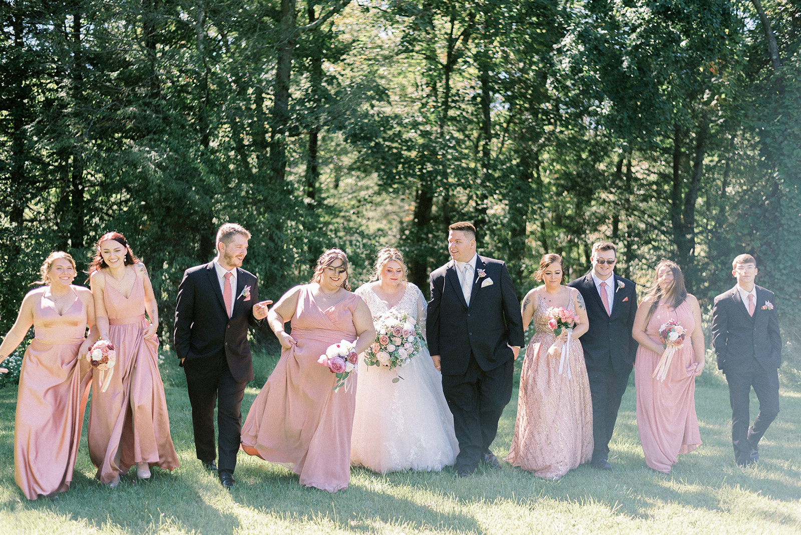 Pennsylvania wedding photographer captures wedding party walking together after wedding