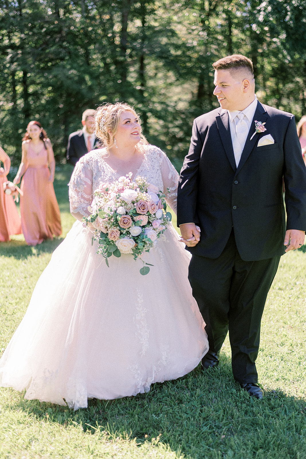 Pennsylvania wedding photographer captures bride and groom looking at one another while walking