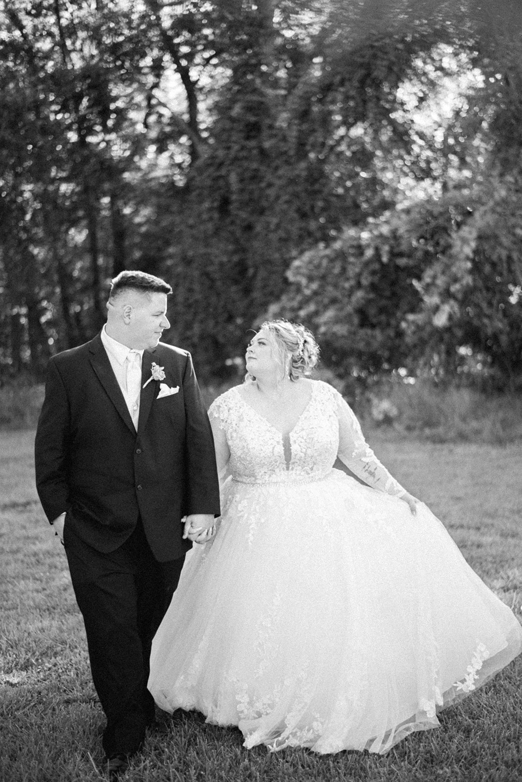 Pennsylvania wedding photographer captures bride and groom walking together after wedding ceremony
