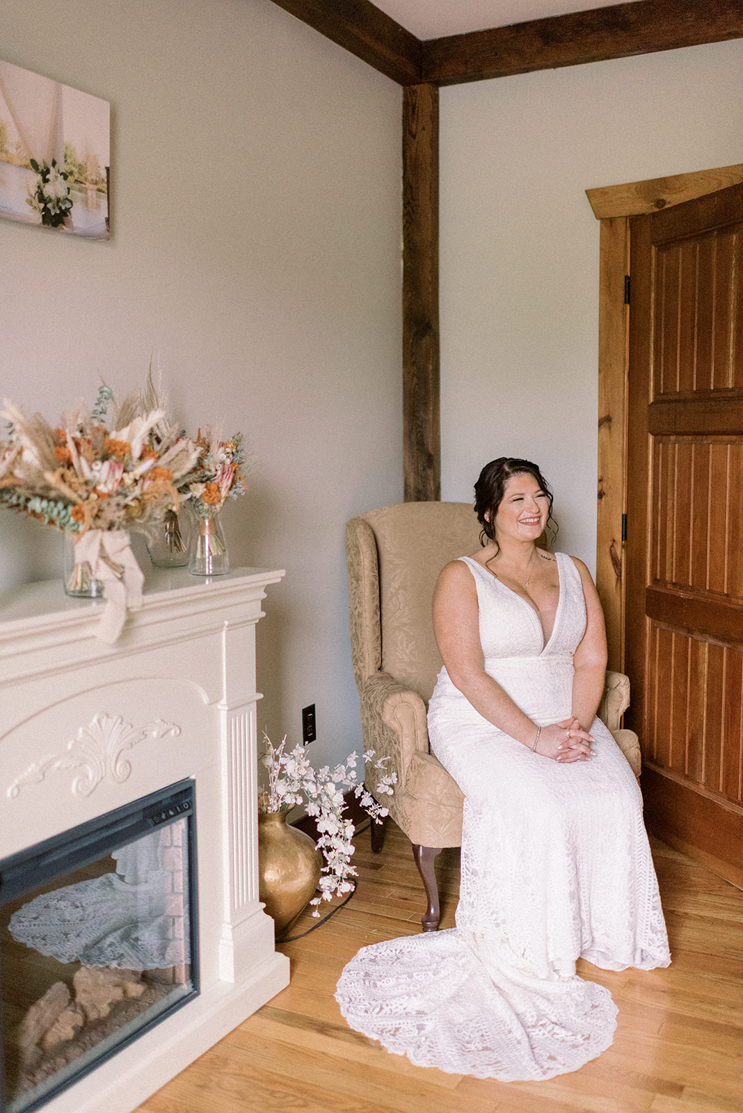 Pennsylvania wedding photographer captures bride sitting in chair while wearing wedding dress