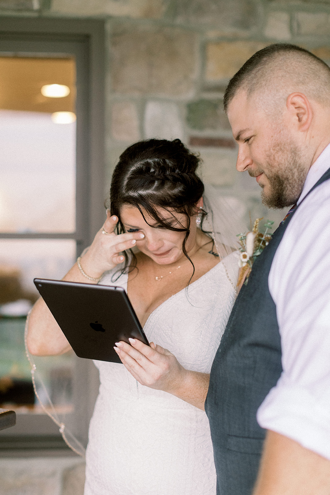Pennsylvania wedding photographer captures bride crying while holding iPad