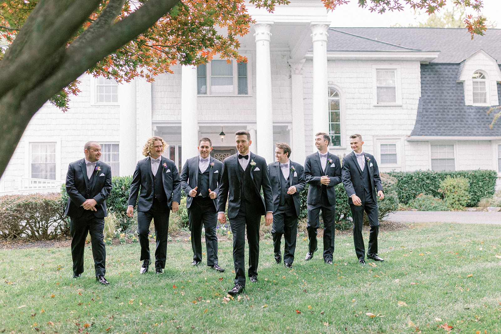 Pennsylvania wedding photographer captures groom walking with groomsmen