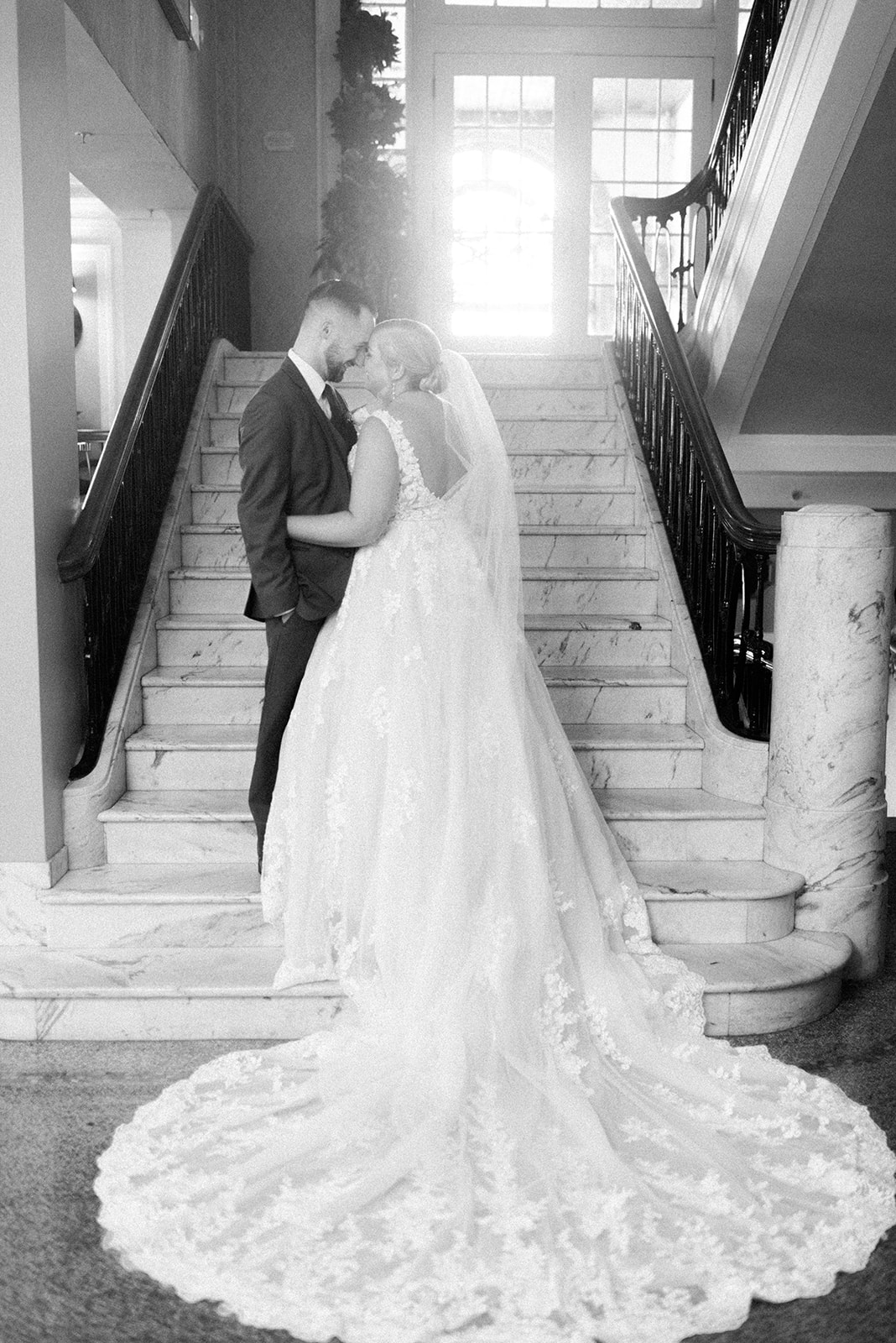 Pennsylvania wedding photographer captures couple on stairs embracing