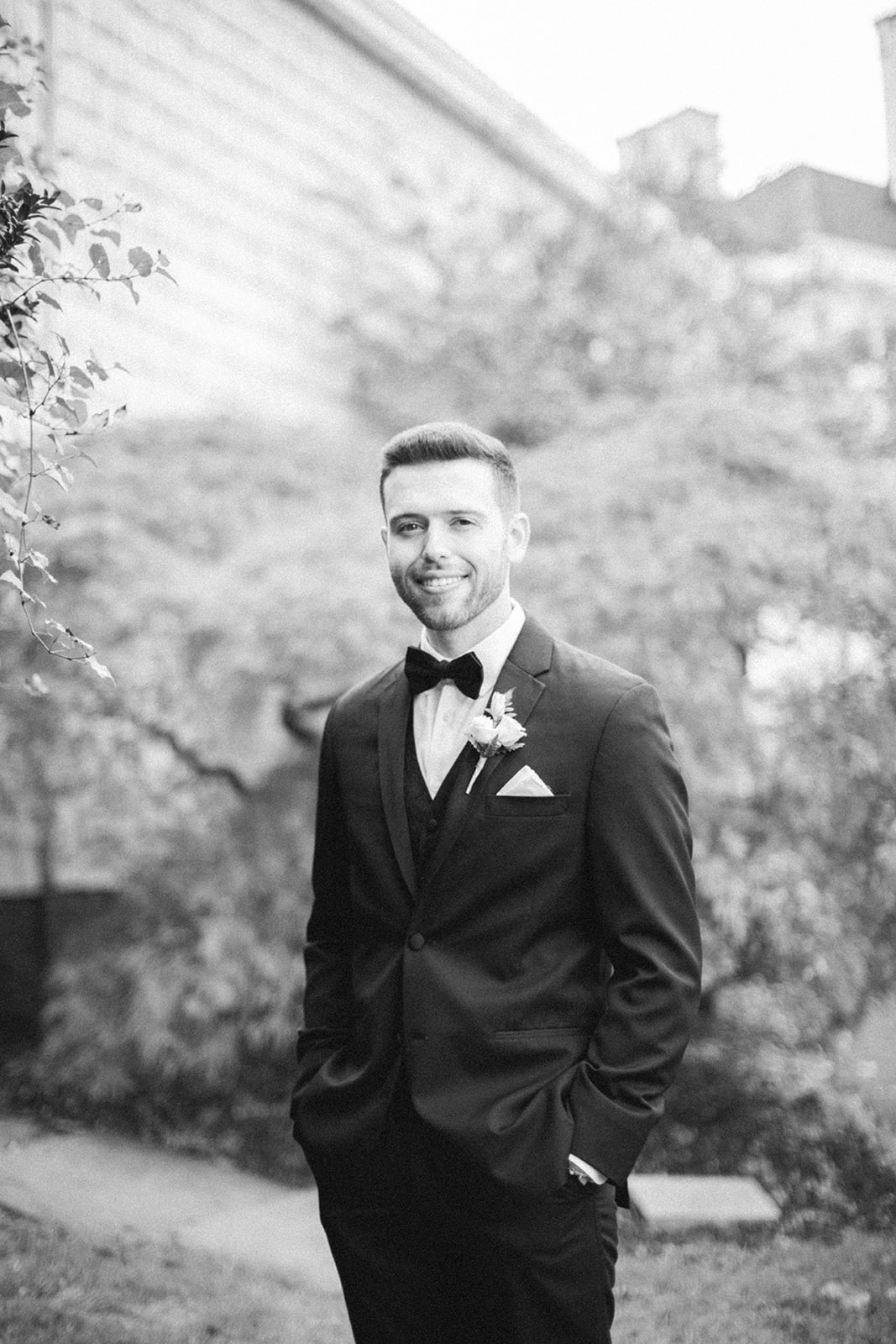 Pennsylvania wedding photographer captures black and white portrait of groom wearing tuxedo