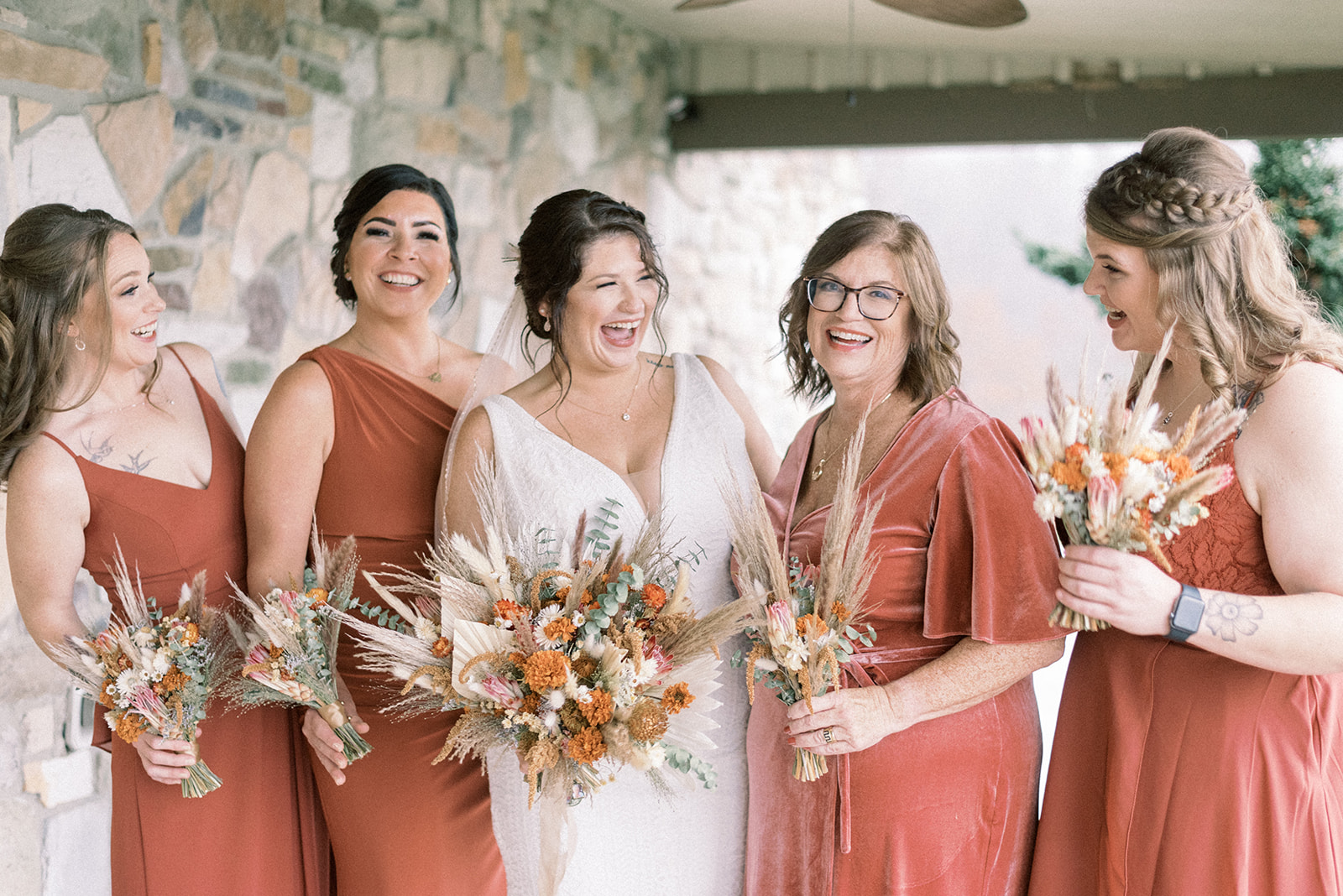 Pennsylvania wedding photographer captures bride laughing with bridesmaids
