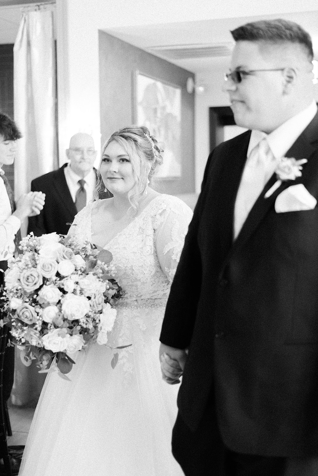 Pennsylvania wedding photographer captures bride and groom entering reception