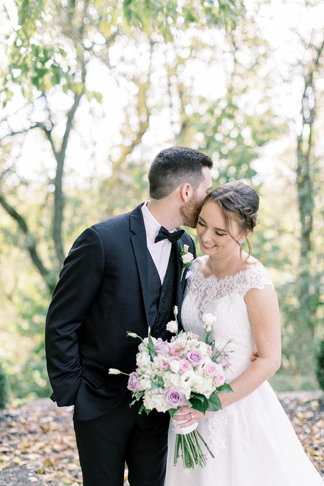 Pennsylvania wedding photographer captures groom kissing brides cheek