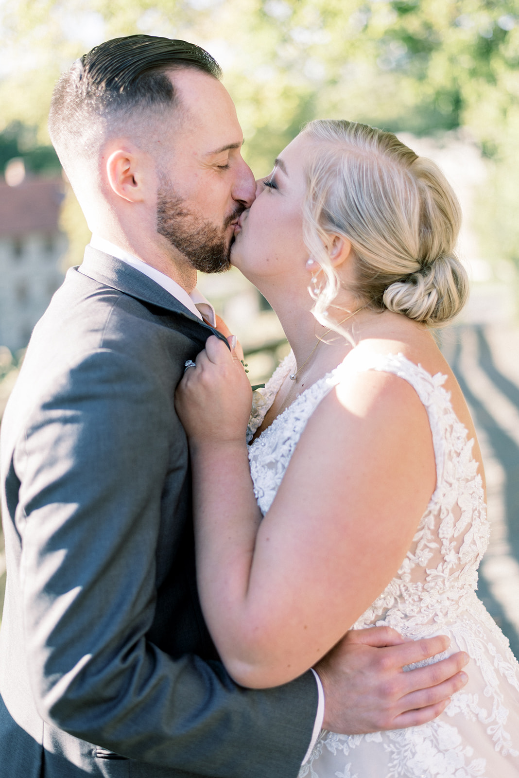 Pennsylvania wedding photographer captures newly married couple kissing during portraits