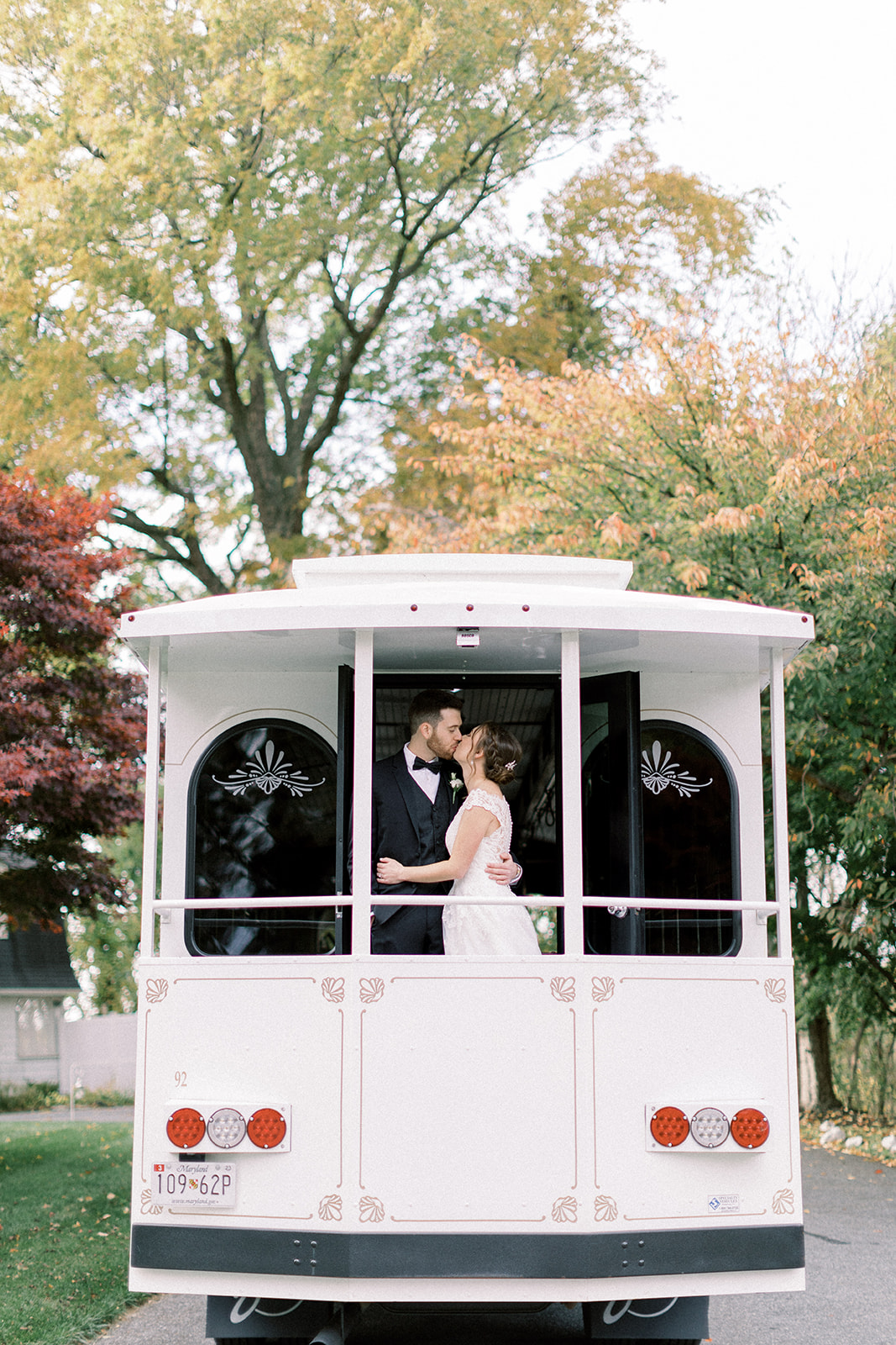 Pennsylvania wedding photographer captures bride and groom kissing on trolley
