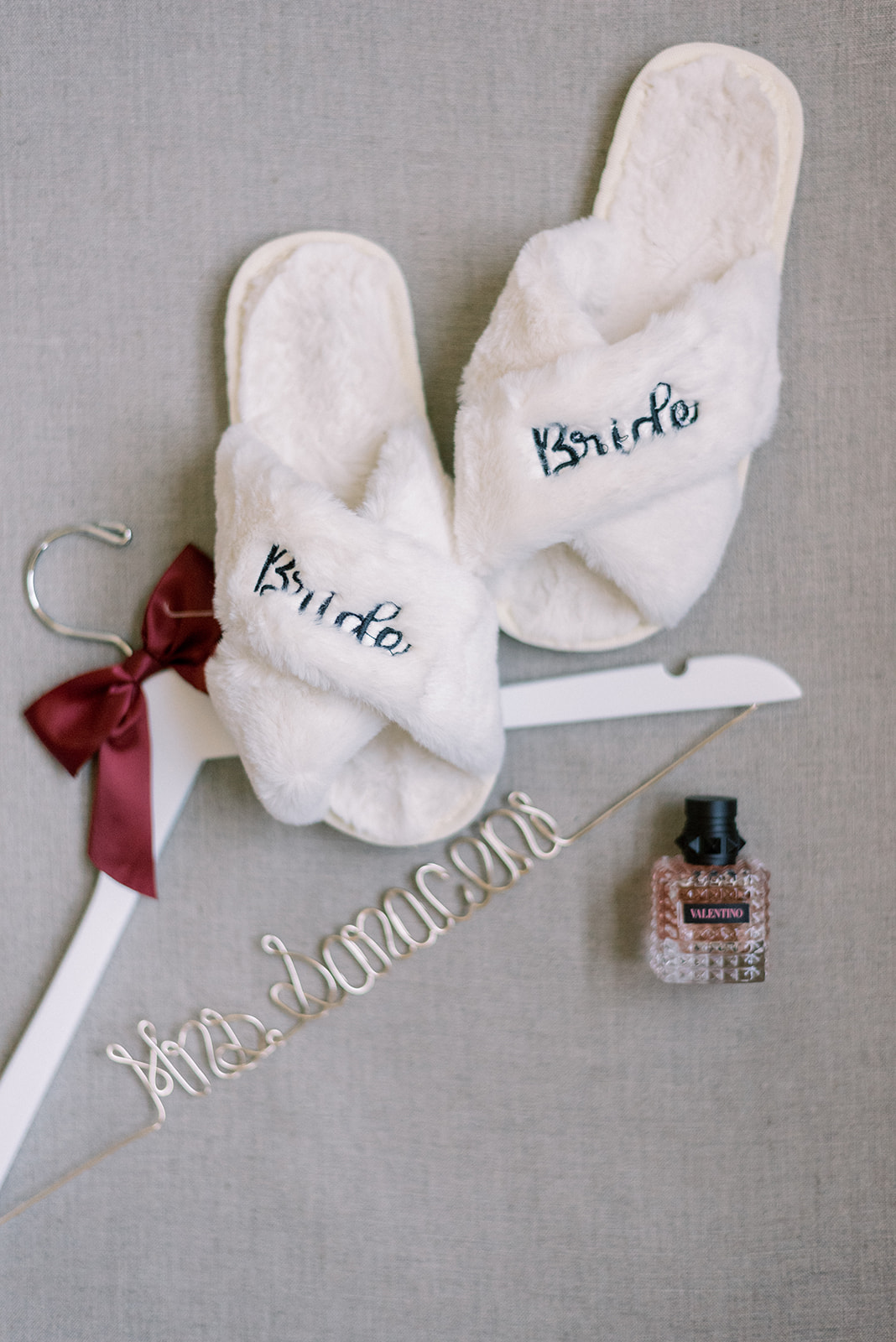 Pennsylvania wedding photographer captures bridal details with slippers, hanger and perfume